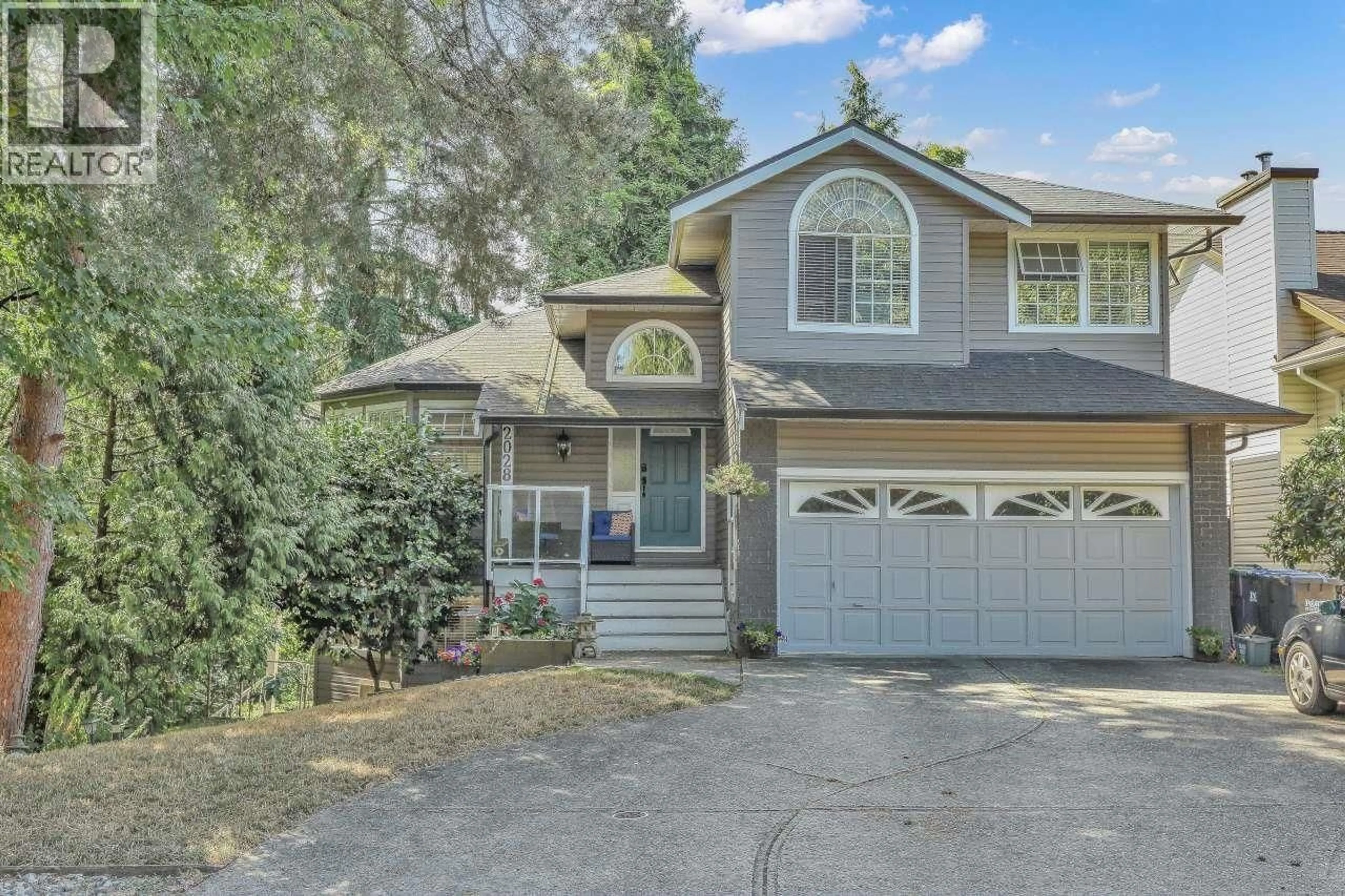 Home with vinyl exterior material, street for 2028 SASKATCHEWAN AVENUE, Port Coquitlam British Columbia V3C5H6
