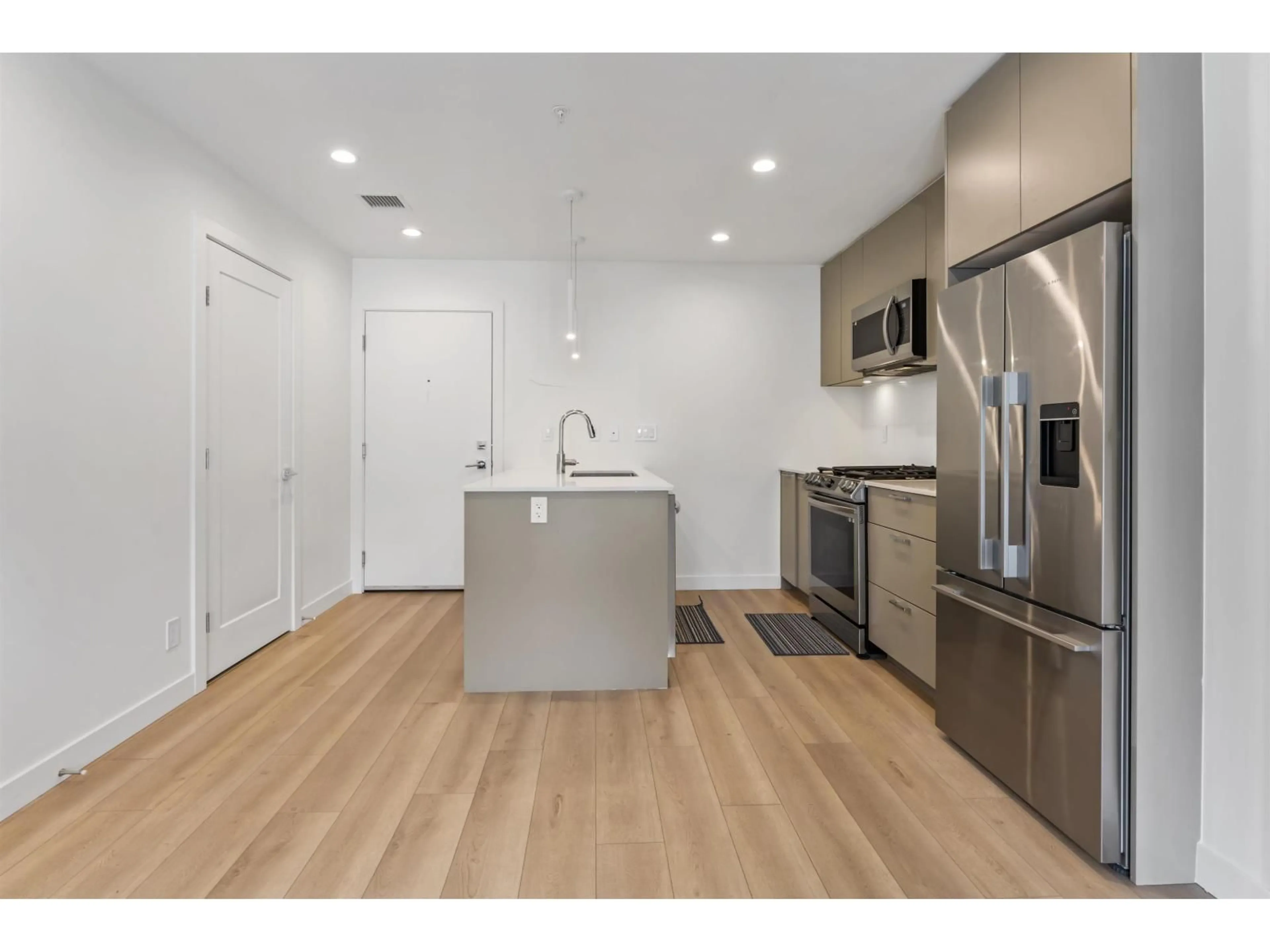 Open concept kitchen, wood/laminate floor for 603 - 8380 200A STREET, Langley British Columbia V1M3Y4