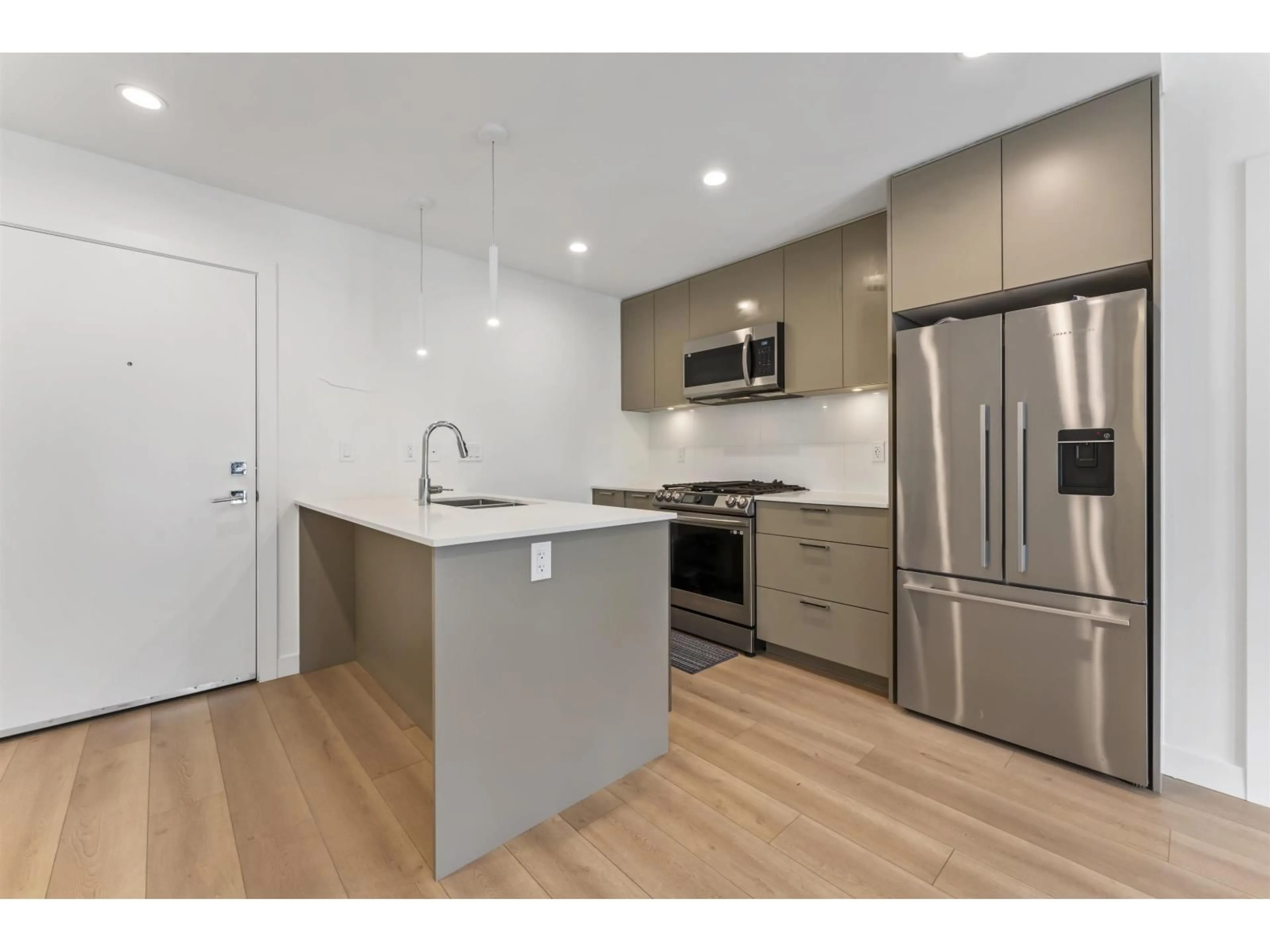 Open concept kitchen, wood/laminate floor for 603 - 8380 200A STREET, Langley British Columbia V1M3Y4