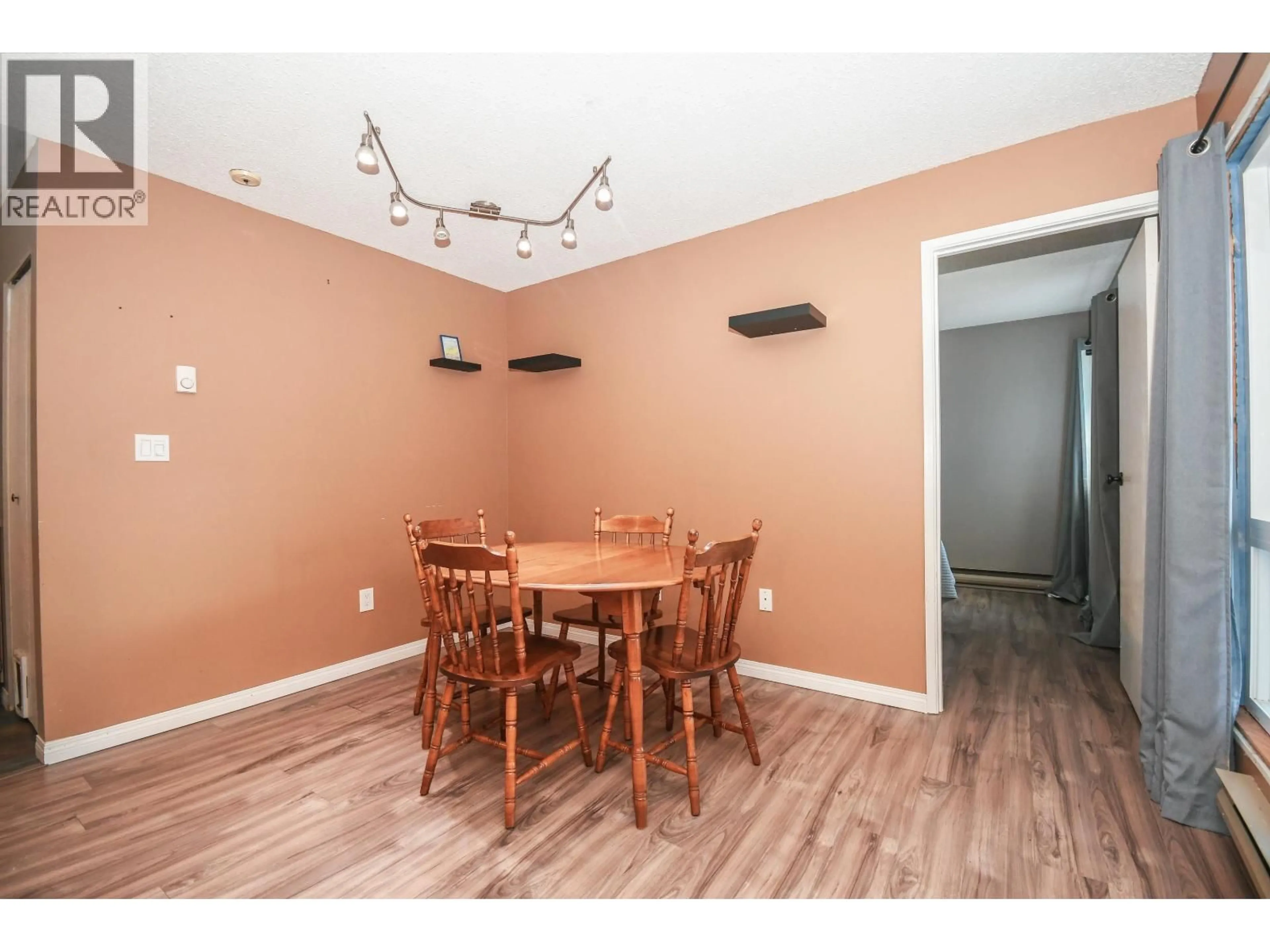 Dining room, wood/laminate floor for 214 - 3033 OSPIKA BOULEVARD, Prince George British Columbia V2N4L5