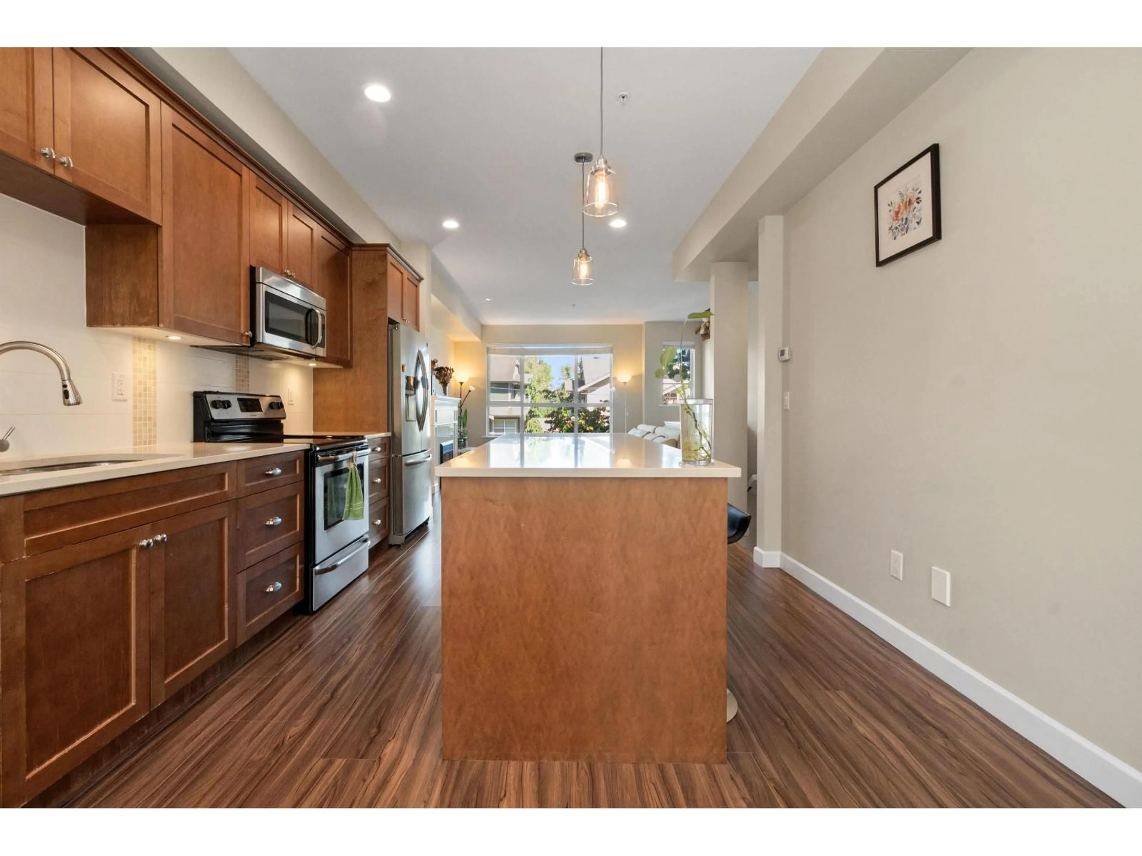 Open concept kitchen, wood/laminate floor for 56 - 7059 210 STREET, Langley British Columbia V2Y0T2