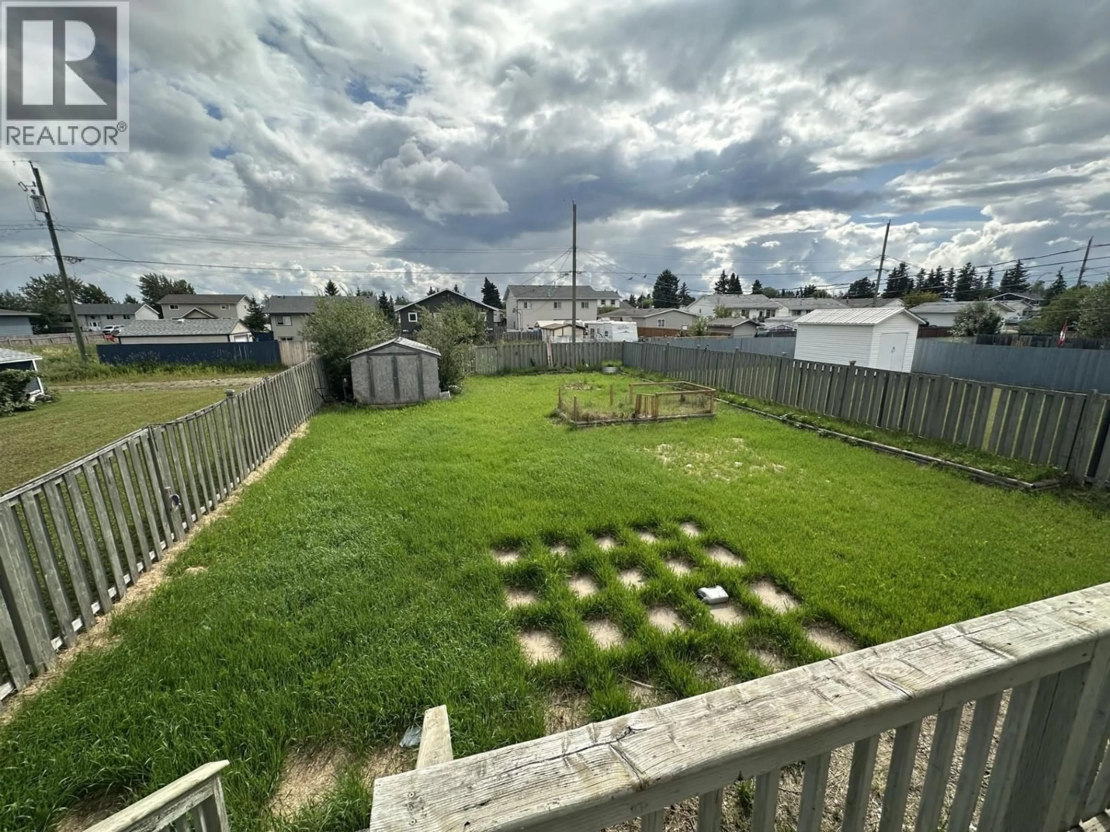 A pic from outside/outdoor area/front of a property/back of a property/a pic from drone, water/lake/river/ocean view for 7923 99 AVENUE, Fort St. John British Columbia V1J1S4