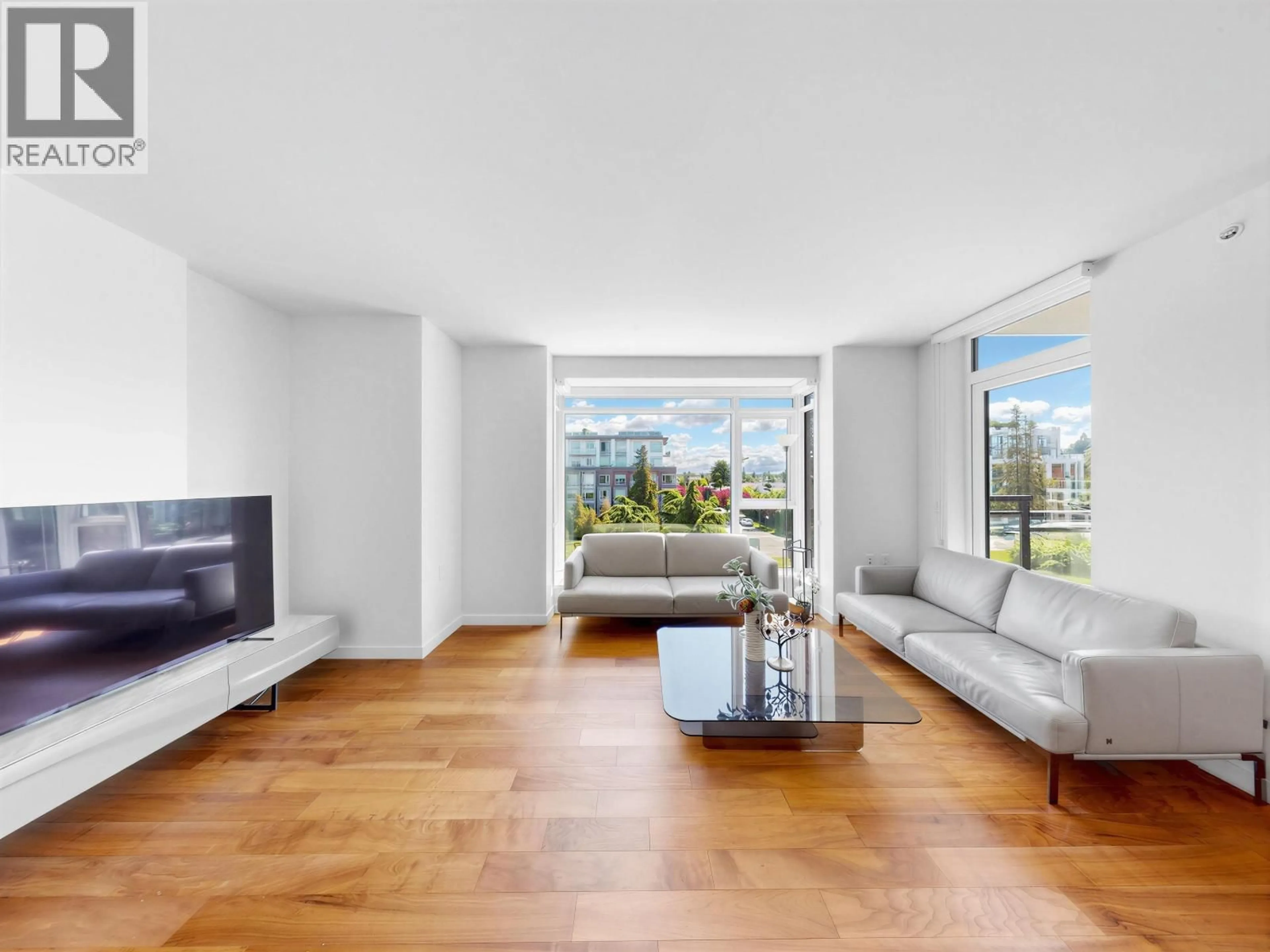 Living room with furniture, wood/laminate floor for 402 - 4189 CAMBIE STREET, Vancouver British Columbia V5Z2Y2