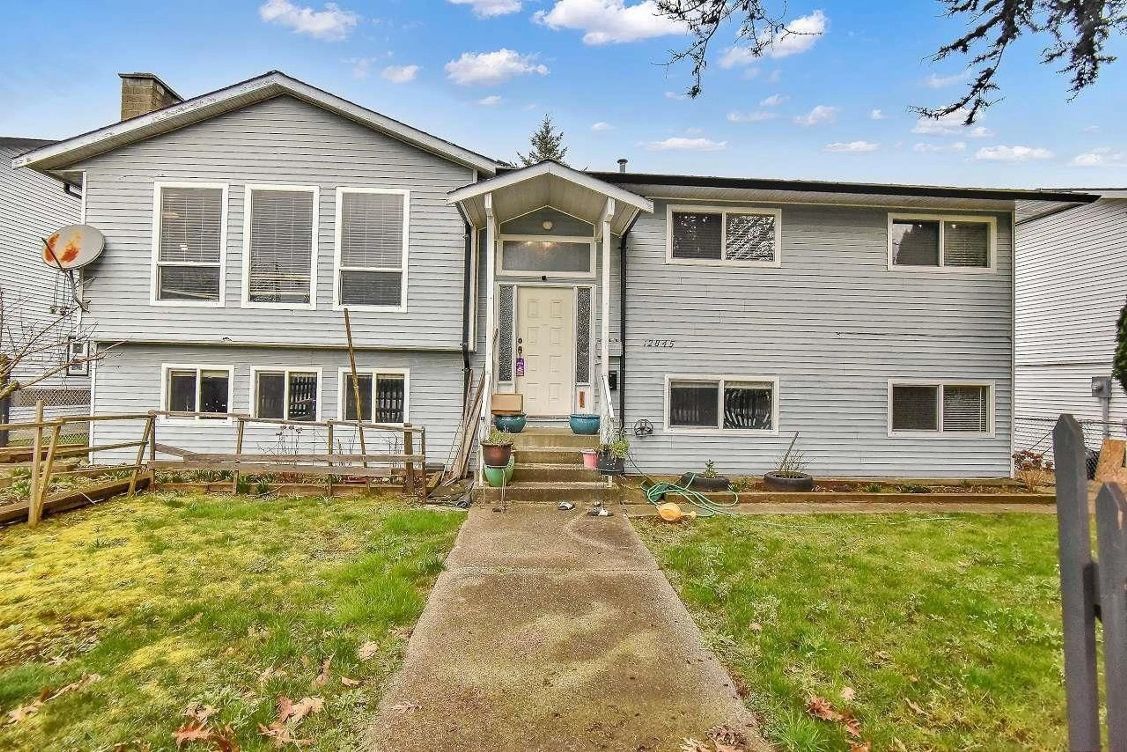 Home with vinyl exterior material, street for 12845 64 AVENUE, Surrey British Columbia V3W1X4
