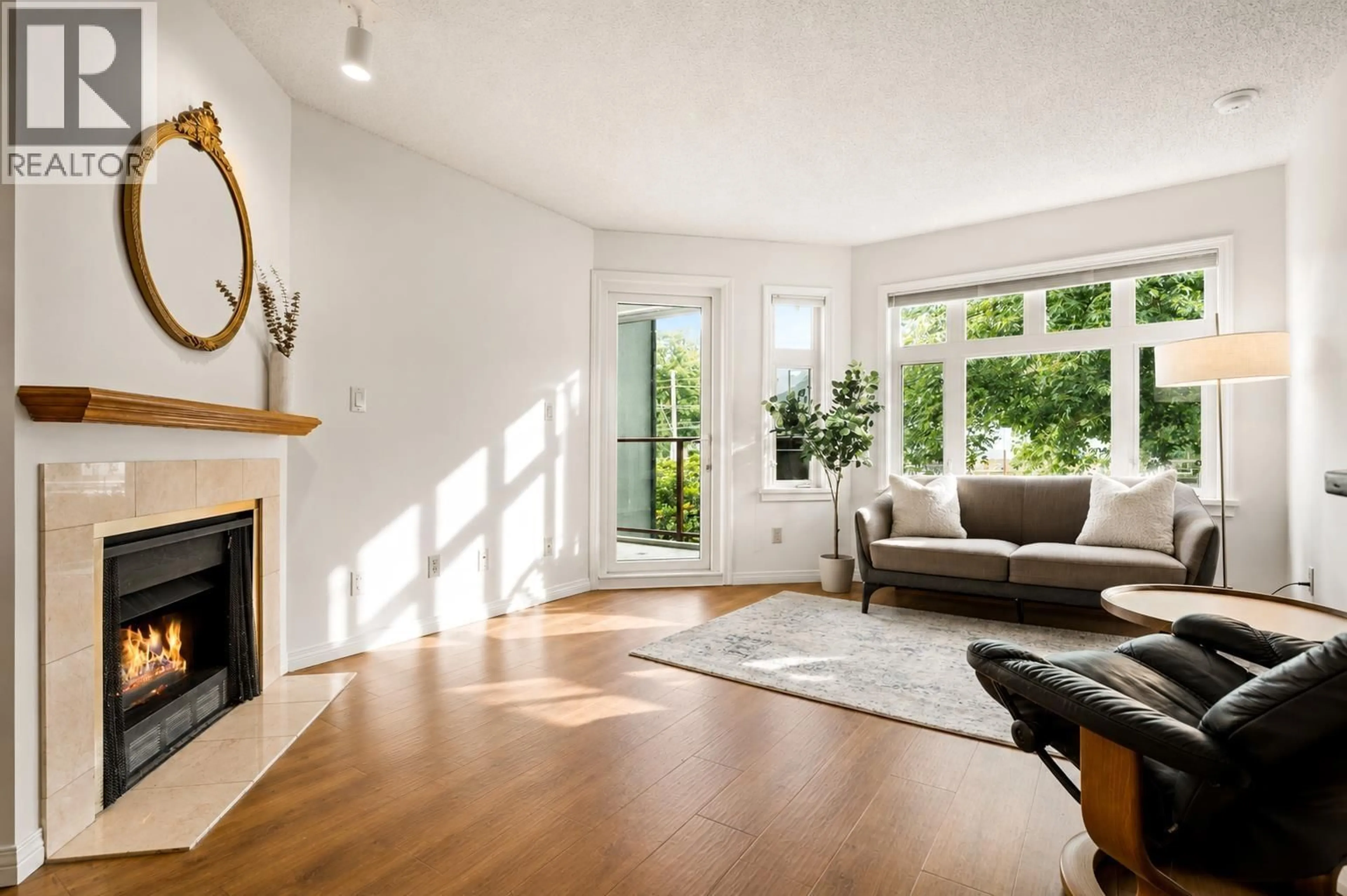 Living room with furniture, wood/laminate floor for 307 - 2800 CHESTERFIELD AVENUE, North Vancouver British Columbia V7N4M1