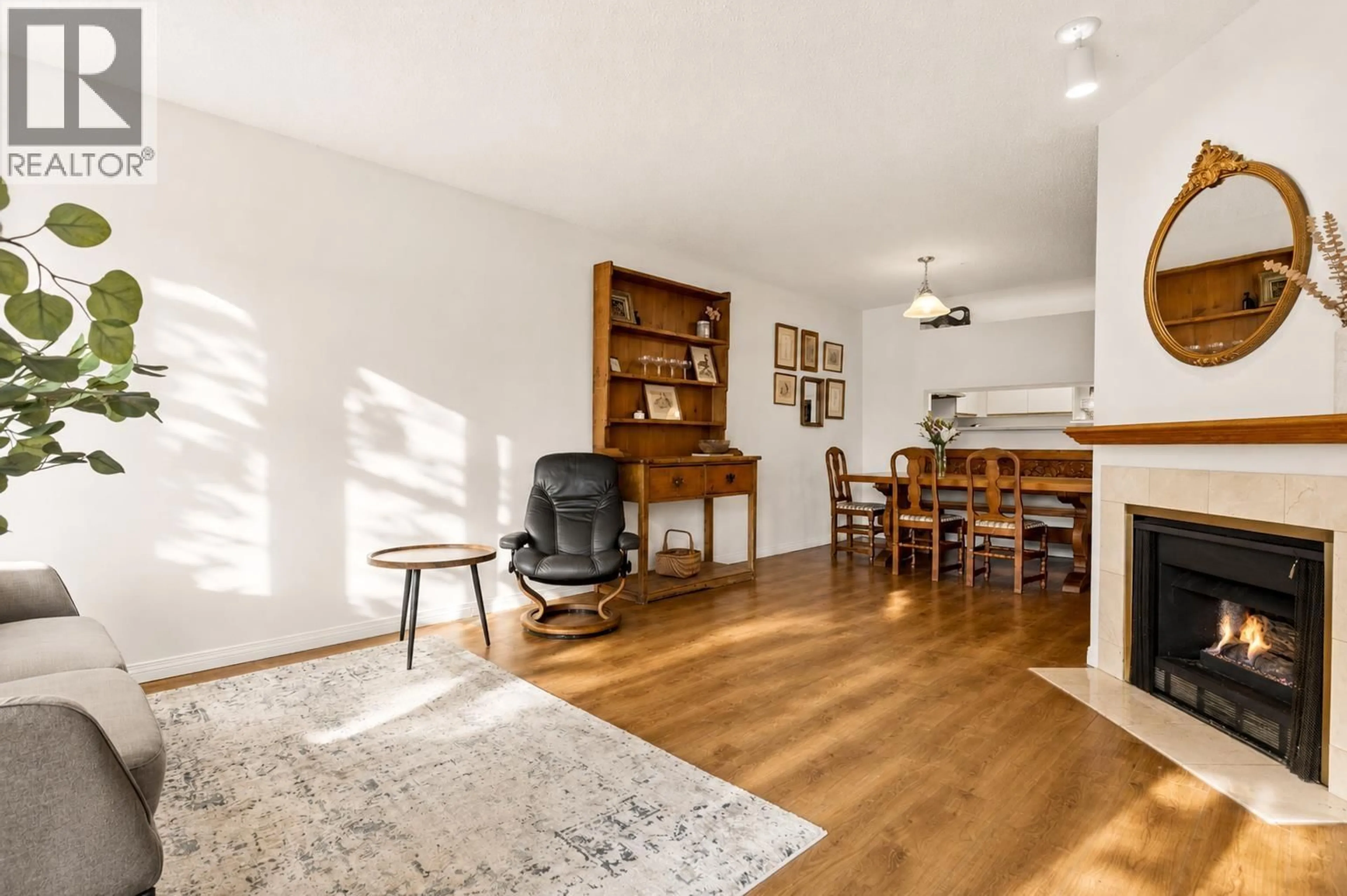 Living room with furniture, wood/laminate floor for 307 - 2800 CHESTERFIELD AVENUE, North Vancouver British Columbia V7N4M1