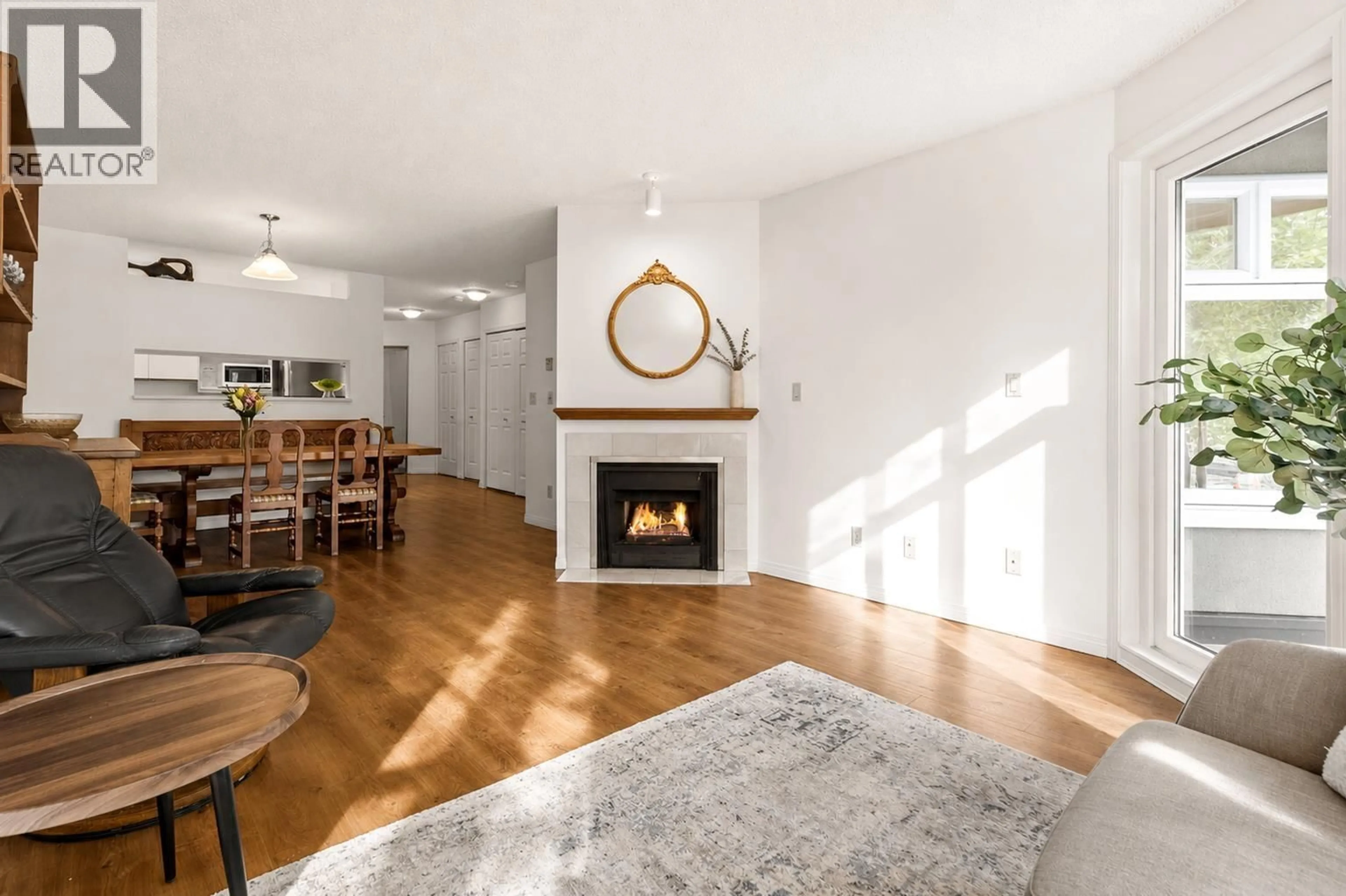 Living room with furniture, wood/laminate floor for 307 - 2800 CHESTERFIELD AVENUE, North Vancouver British Columbia V7N4M1