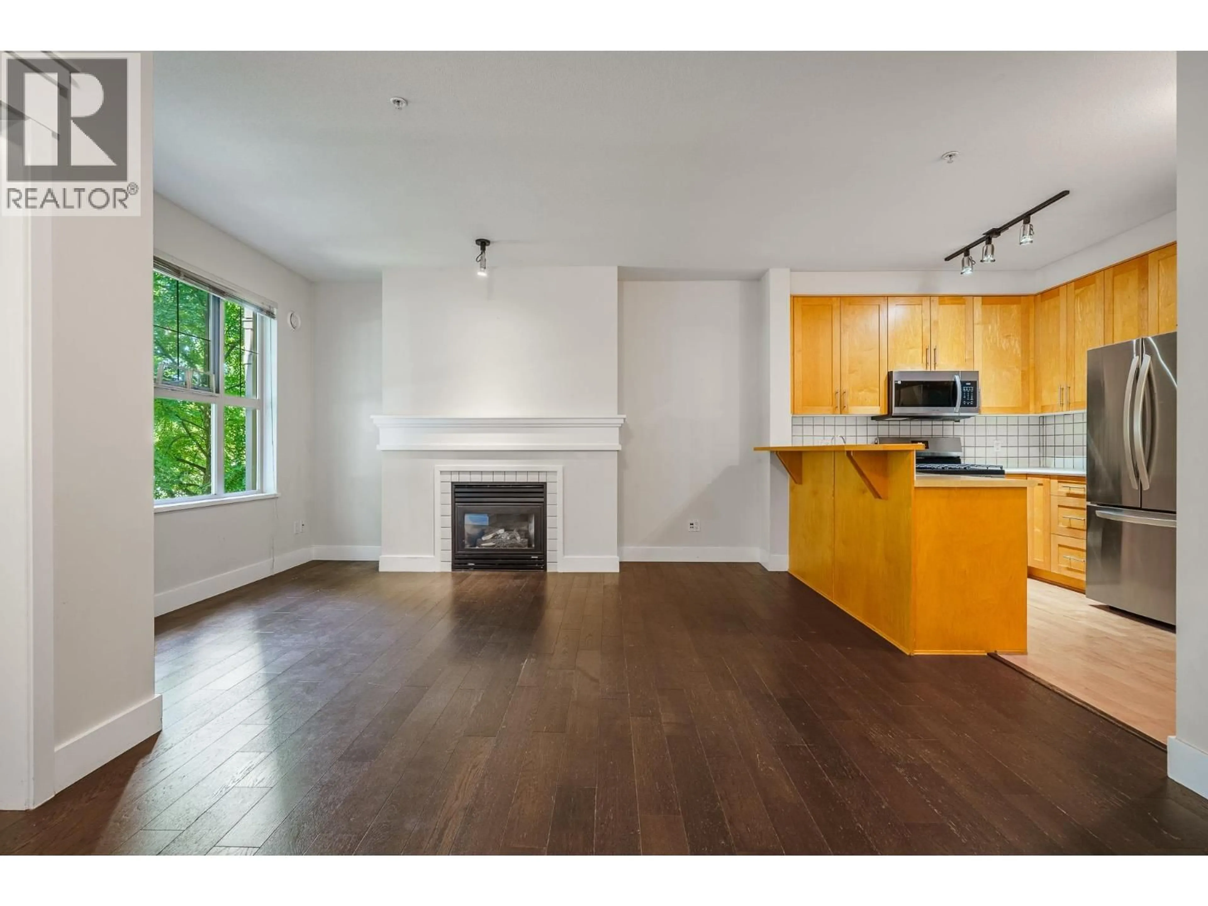 Open concept kitchen, wood/laminate floor for 1217 - 4655 VALLEY DRIVE, Vancouver British Columbia V6J5L6