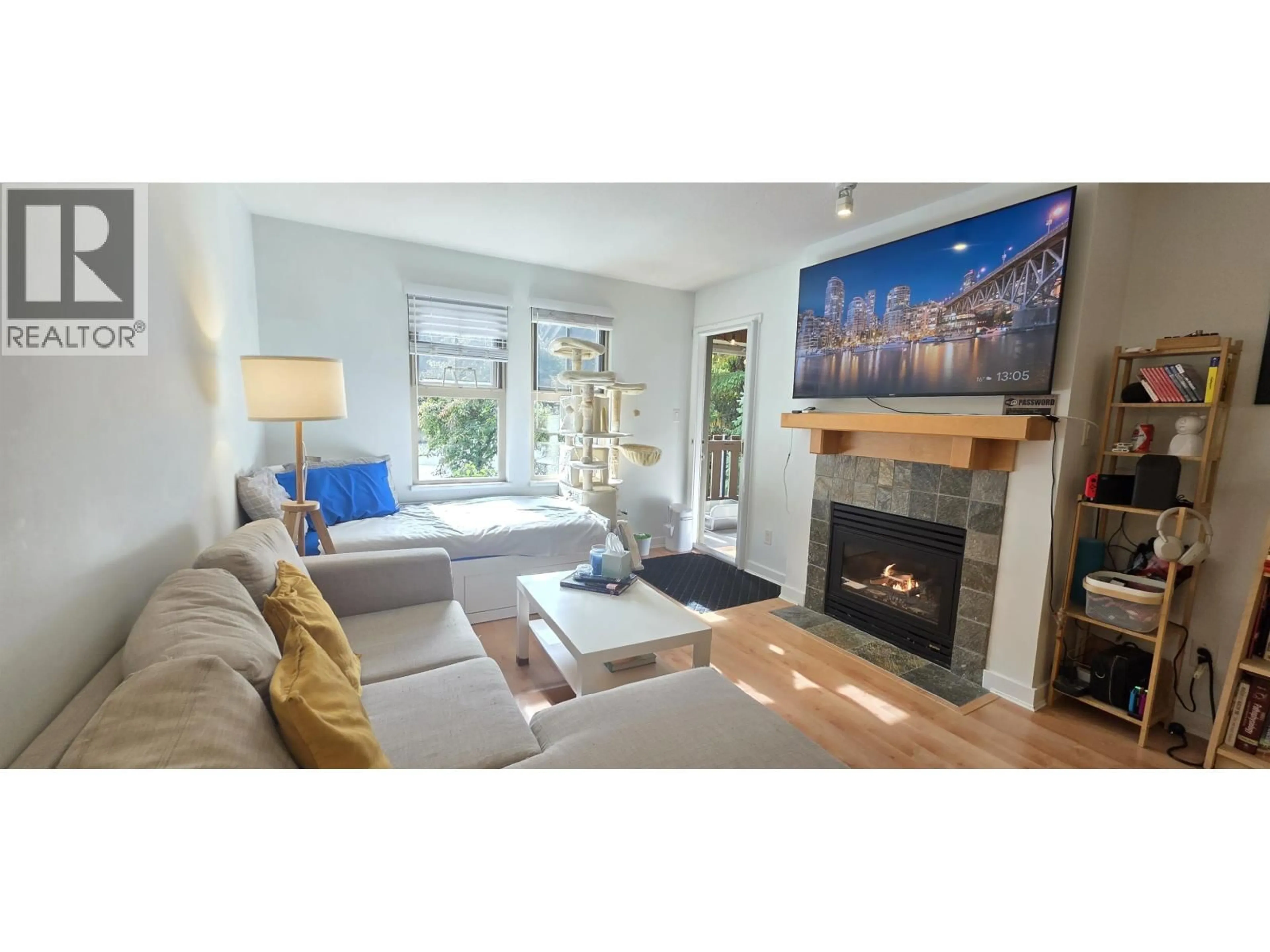 Living room with furniture, wood/laminate floor for 201 - 15 SMOKEY SMITH PLACE PLACE, New Westminster British Columbia V3L5V7