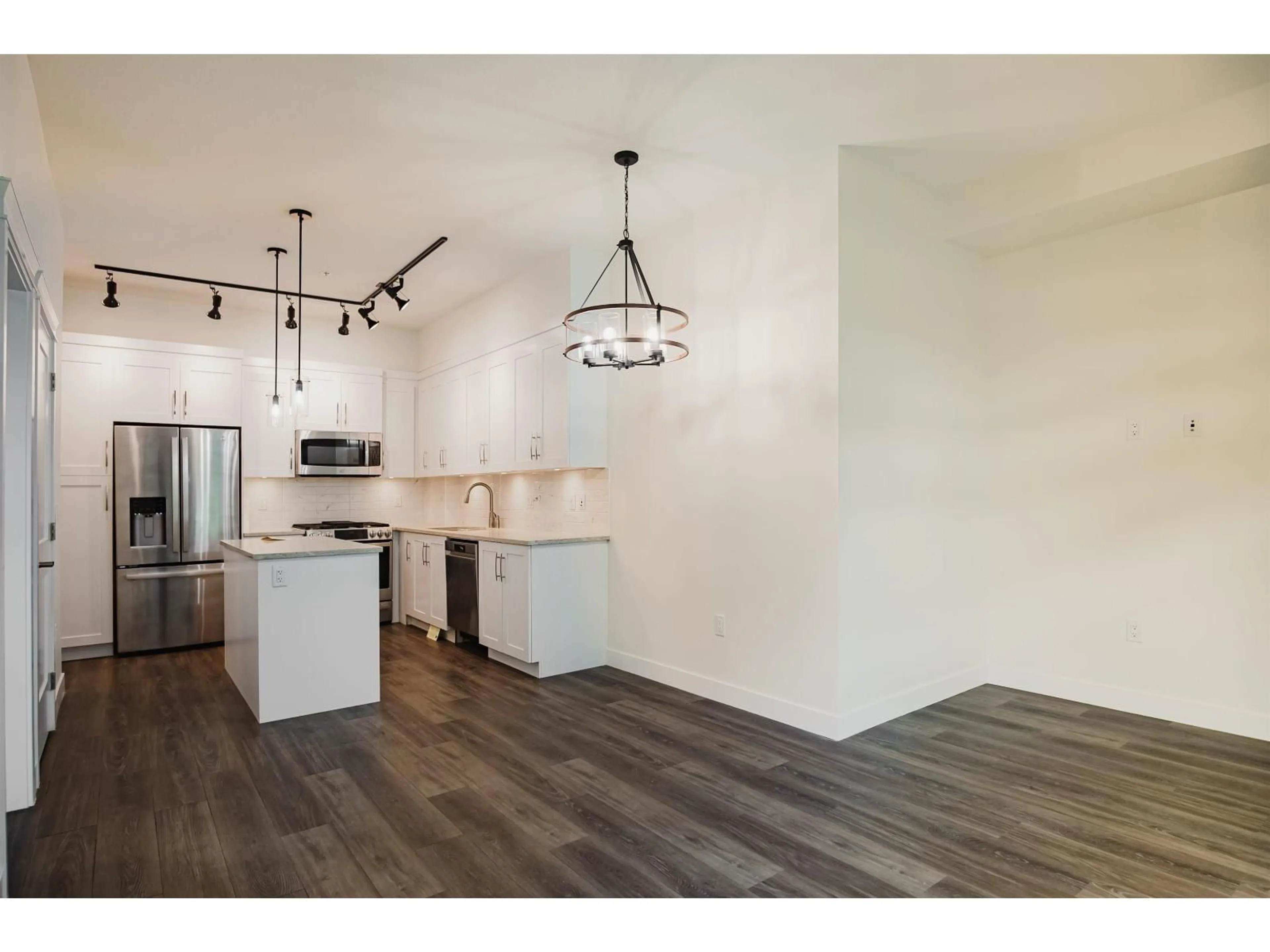 Open concept kitchen, wood/laminate floor for 4 - 11077 RAVINE ROAD, Surrey British Columbia V3T0R7