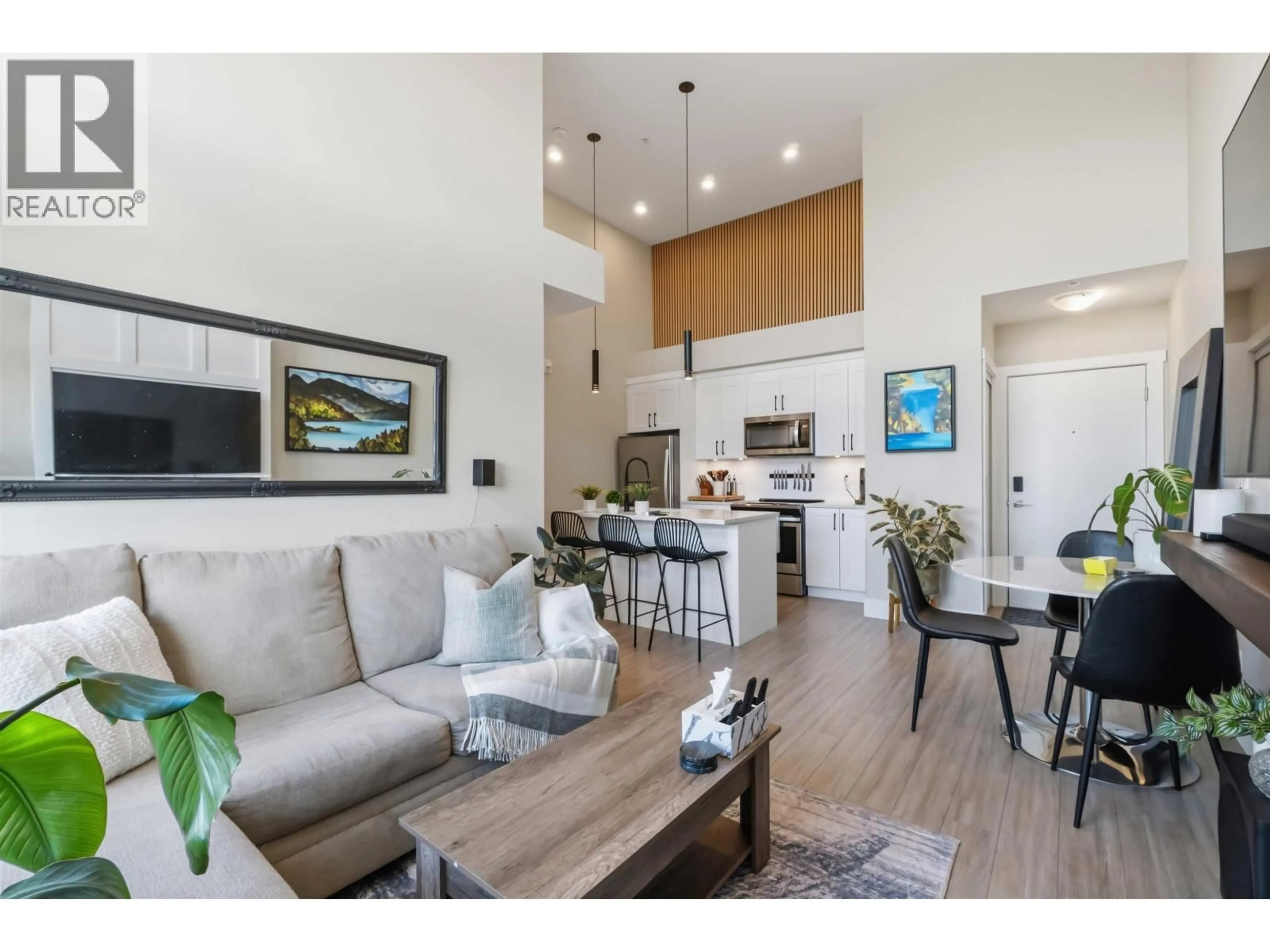 Open concept kitchen, wood/laminate floor for 607 - 22335 MCINTOSH AVENUE, Maple Ridge British Columbia V2X3C2