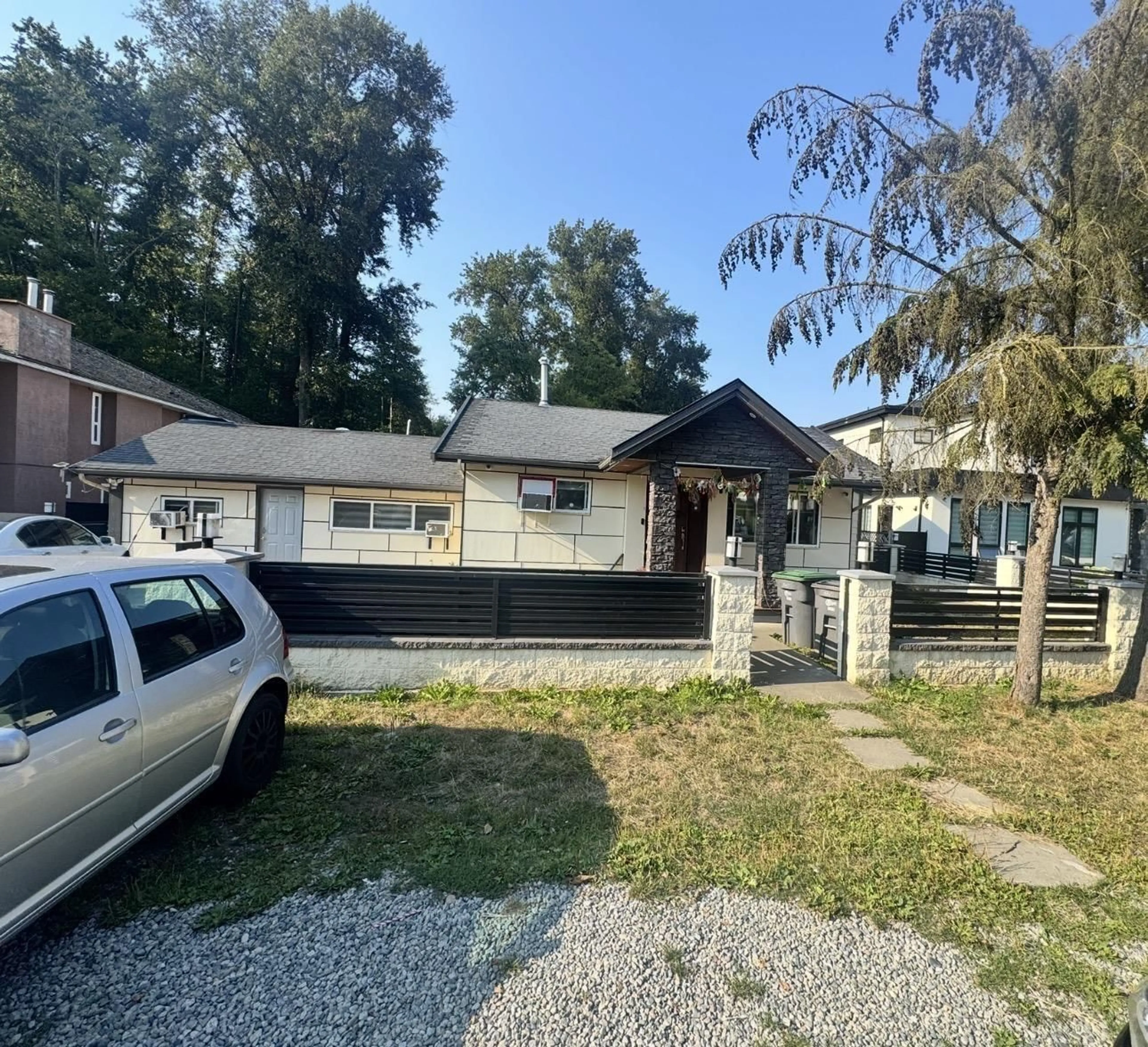 Home with vinyl exterior material, street for 13317 84 AVENUE, Surrey British Columbia V3W3H1