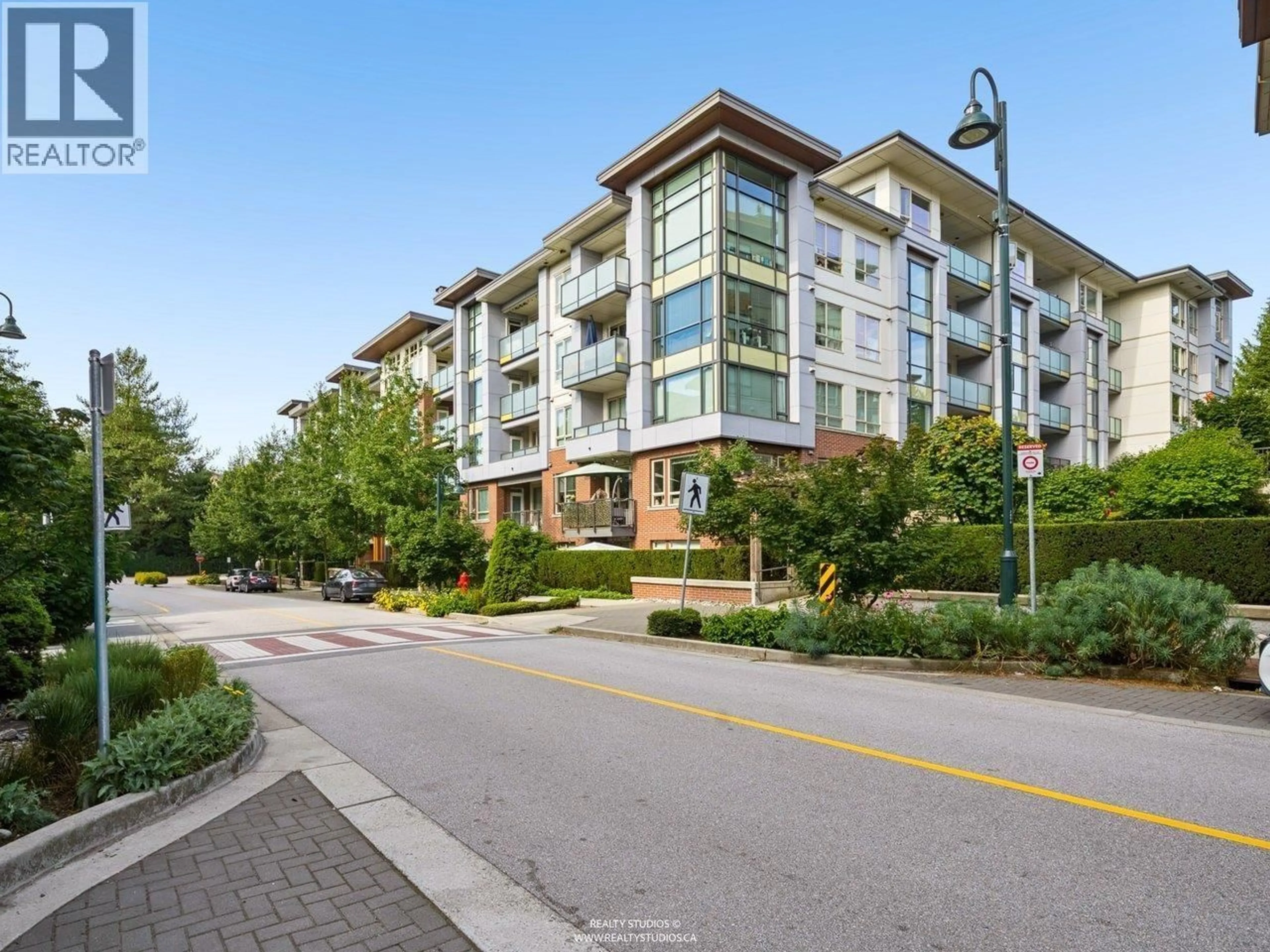 A pic from outside/outdoor area/front of a property/back of a property/a pic from drone, street for 213 - 2651 LIBRARY LANE, North Vancouver British Columbia V7J0C1