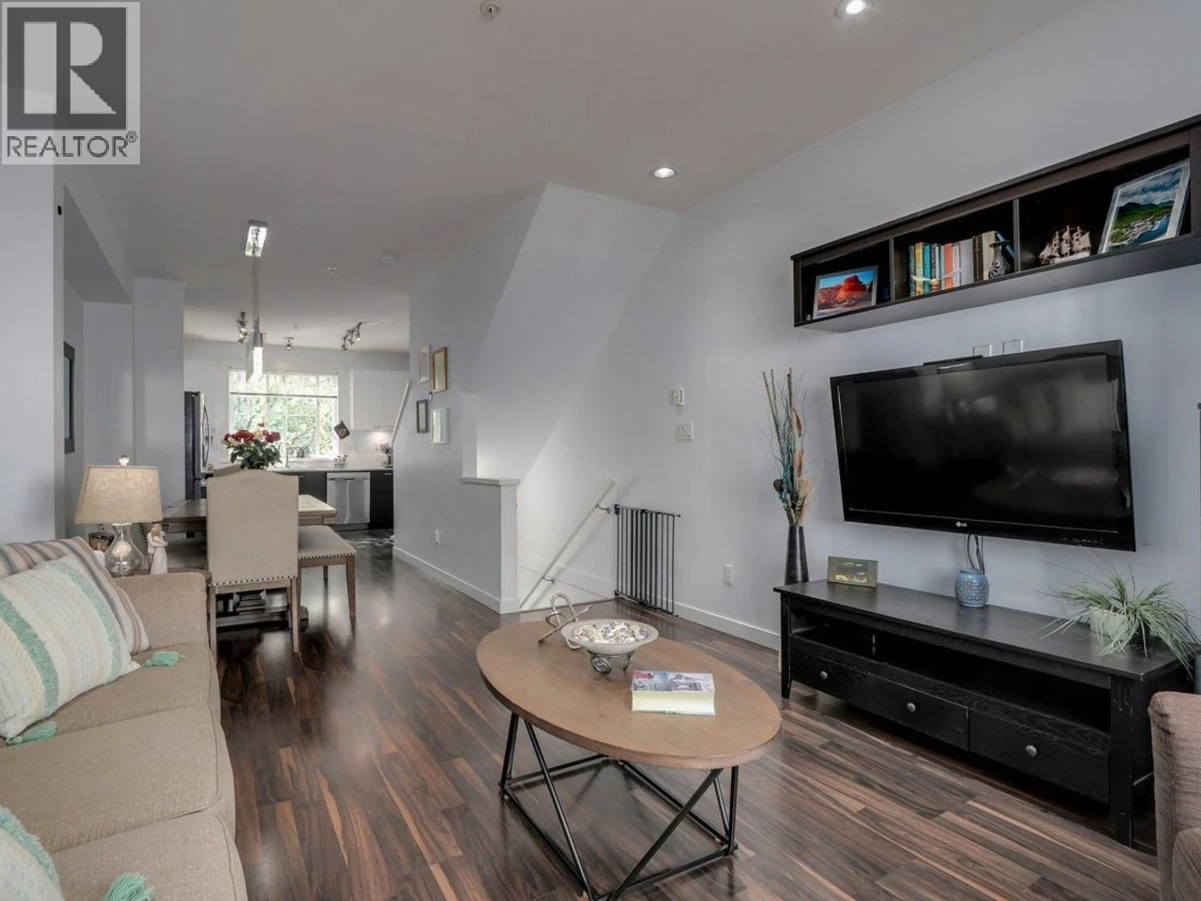 Living room with furniture, wood/laminate floor for 63 - 3010 RIVERBEND DRIVE, Coquitlam British Columbia V3C0B8