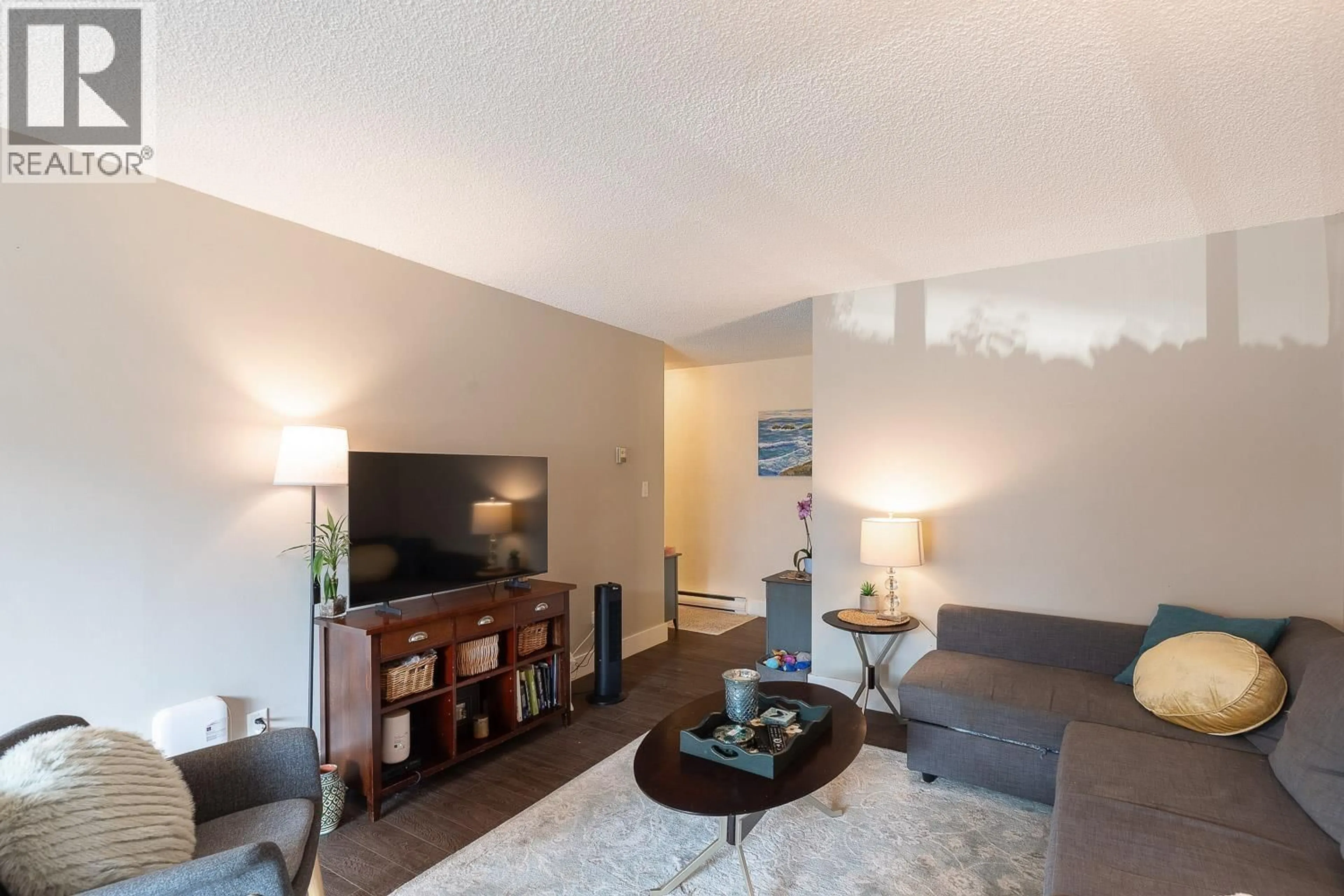 Living room with furniture, wood/laminate floor for 105 - 3371 SPRINGFIELD DRIVE, Richmond British Columbia V7E1Y9