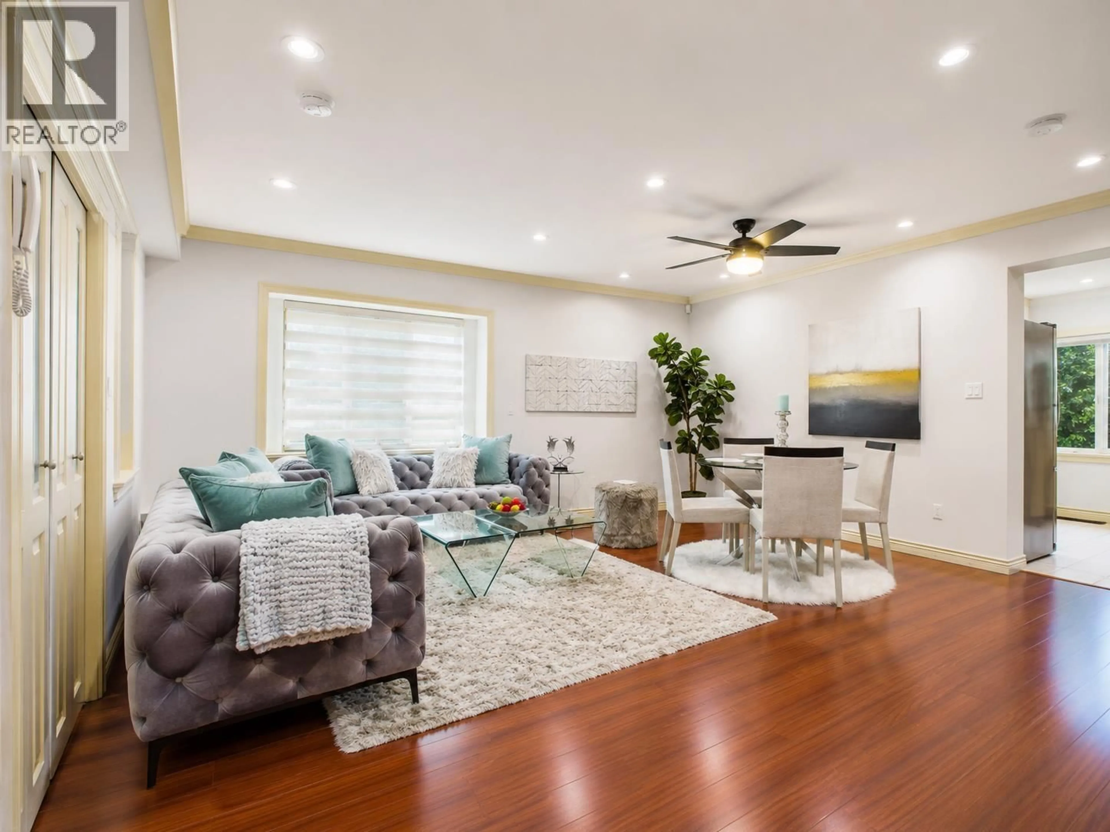 Living room with furniture, wood/laminate floor for 7010 GRIFFITHS AVENUE, Burnaby British Columbia V5E0B2