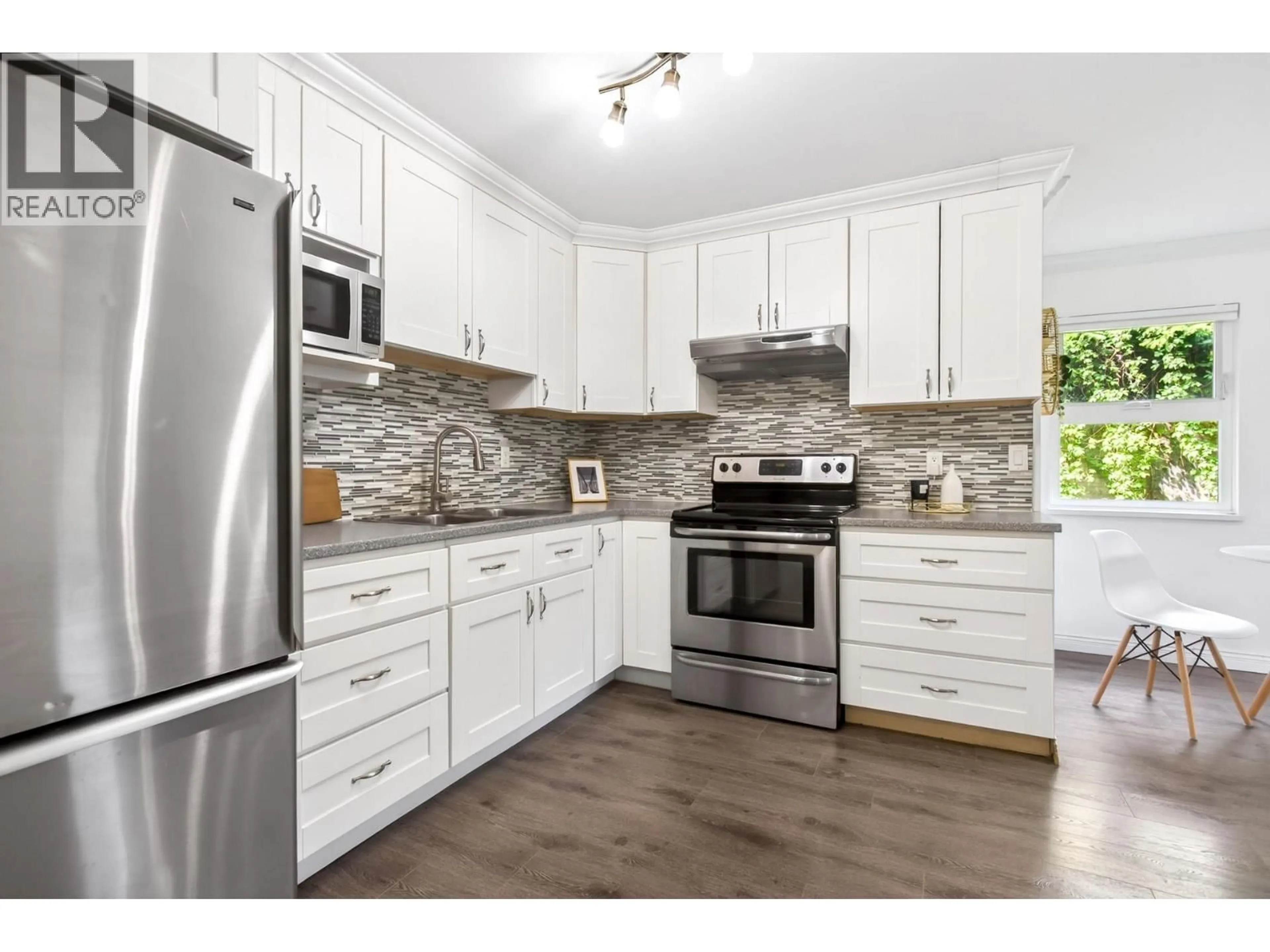 Open concept kitchen, wood/laminate floor for 105 - 1122 KING ALBERT AVENUE, Coquitlam British Columbia V3J1X7