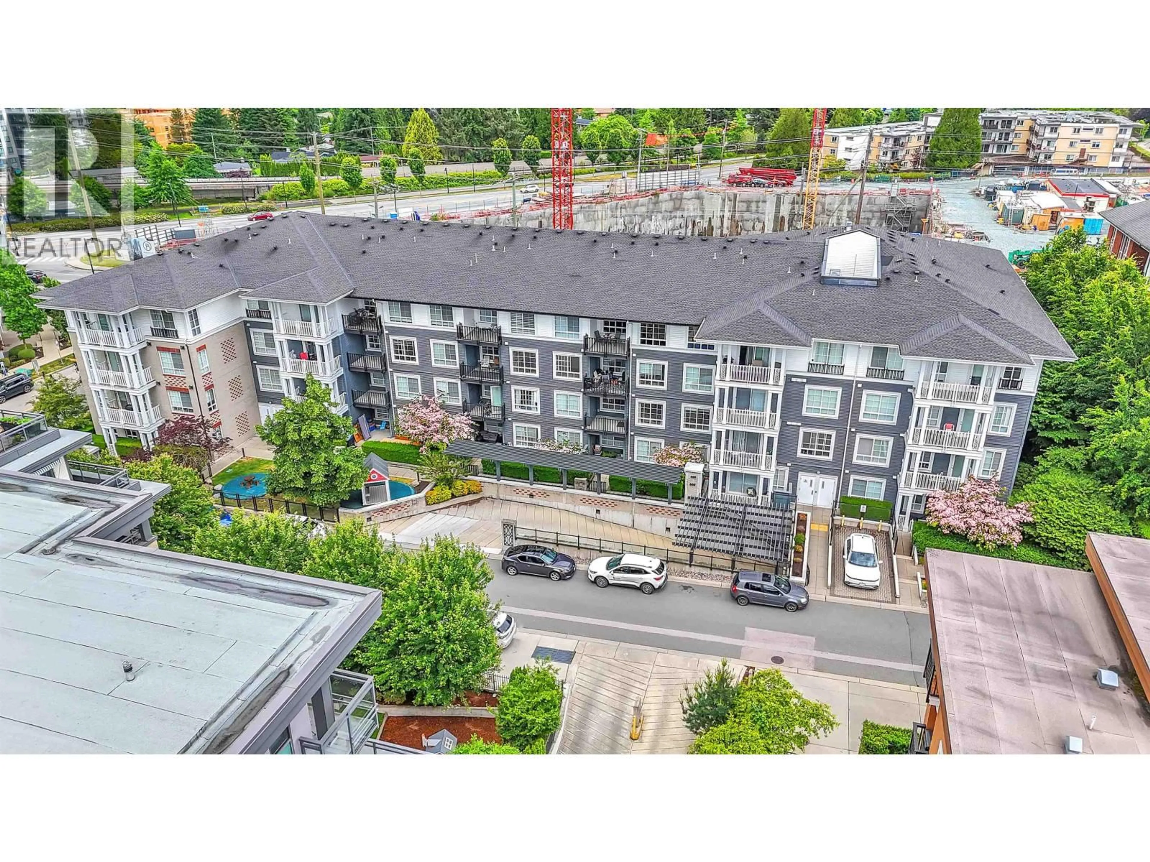 A pic from outside/outdoor area/front of a property/back of a property/a pic from drone, city buildings view from balcony for 107 - 608 COMO LAKE AVENUE, Coquitlam British Columbia V3J0B2