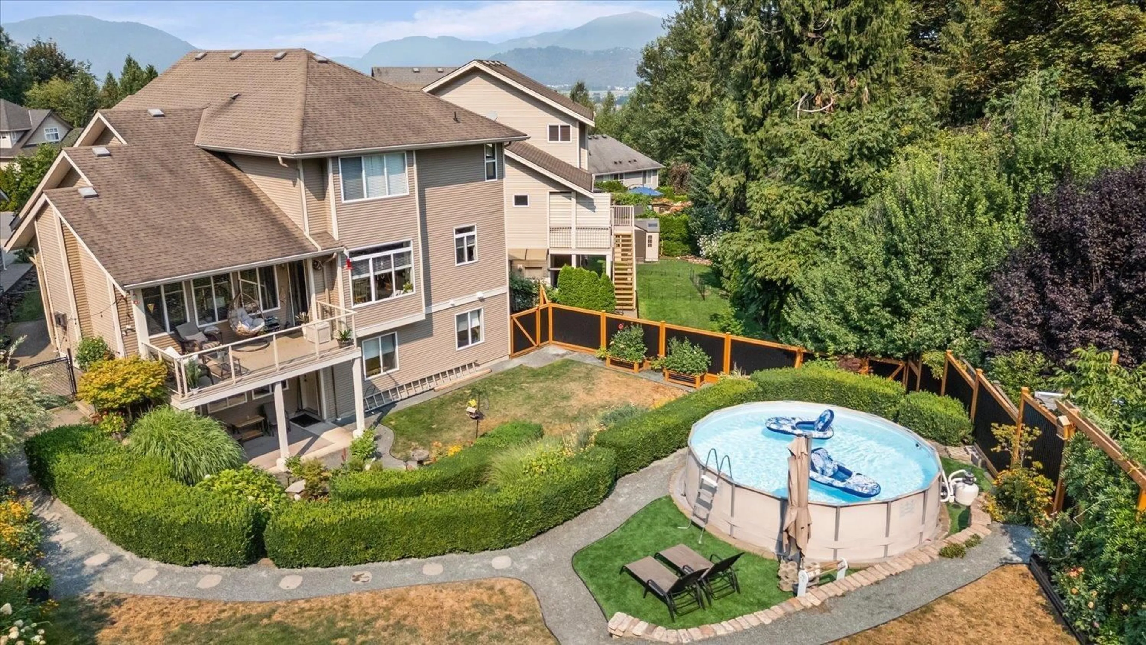 A pic from outside/outdoor area/front of a property/back of a property/a pic from drone, mountain view for 5602 THOM CREEK DRIVE, Chilliwack British Columbia V2R5Z6