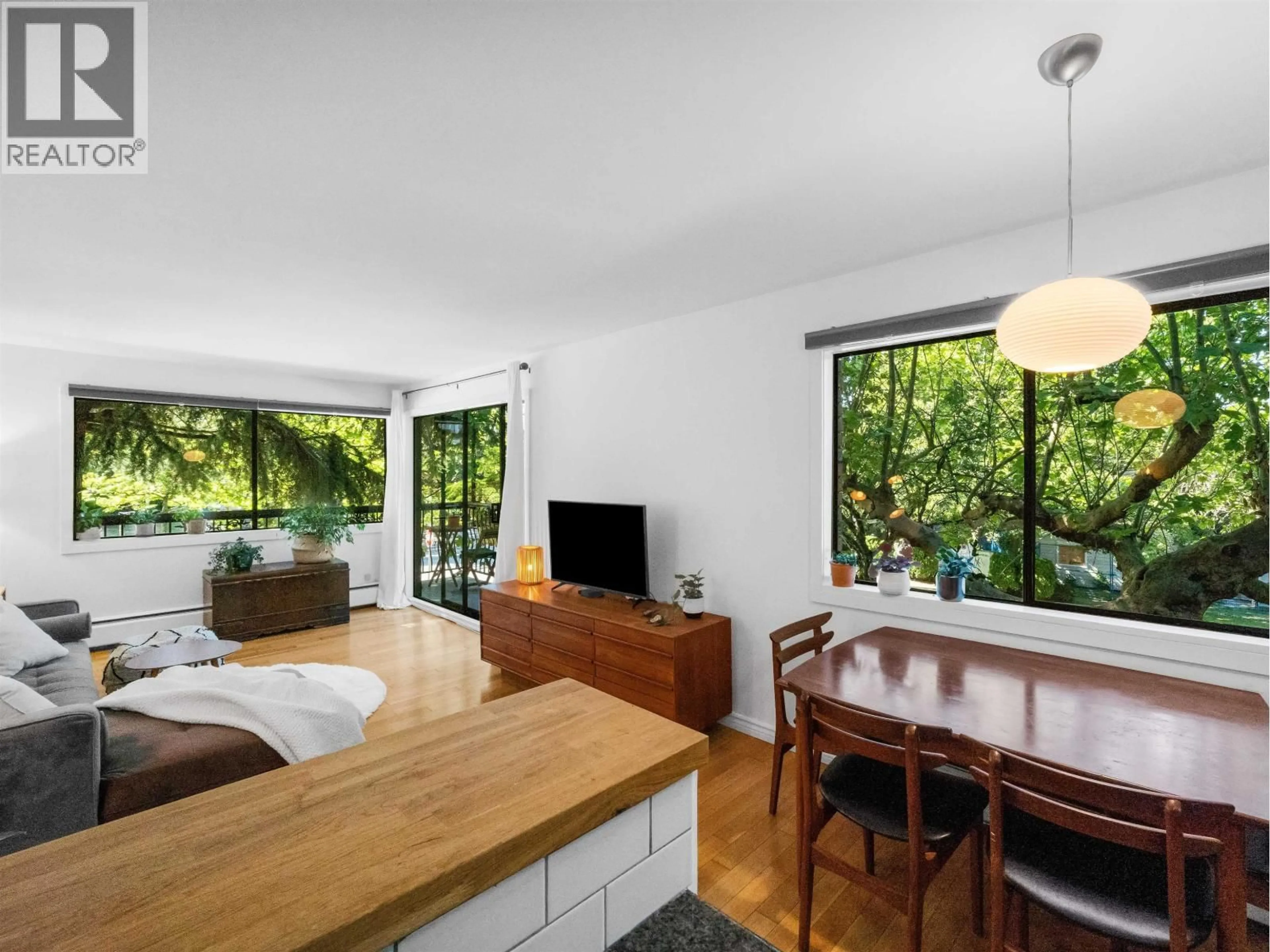 Living room with furniture, wood/laminate floor for 201 - 2330 MAPLE STREET, Vancouver British Columbia V6J3T6