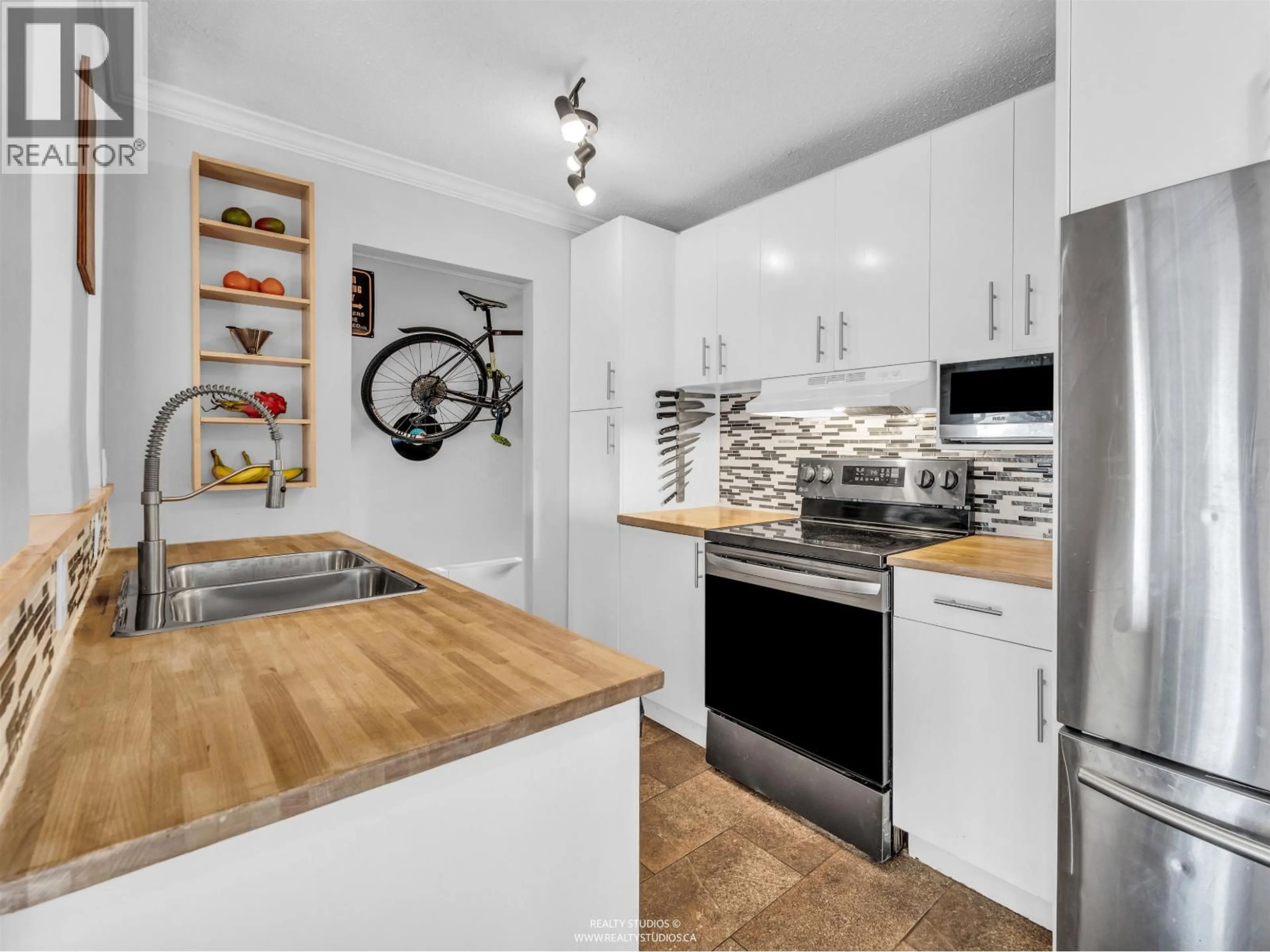 Open concept kitchen, unknown for 306 - 2222 CAMBRIDGE STREET, Vancouver British Columbia V5L1E6