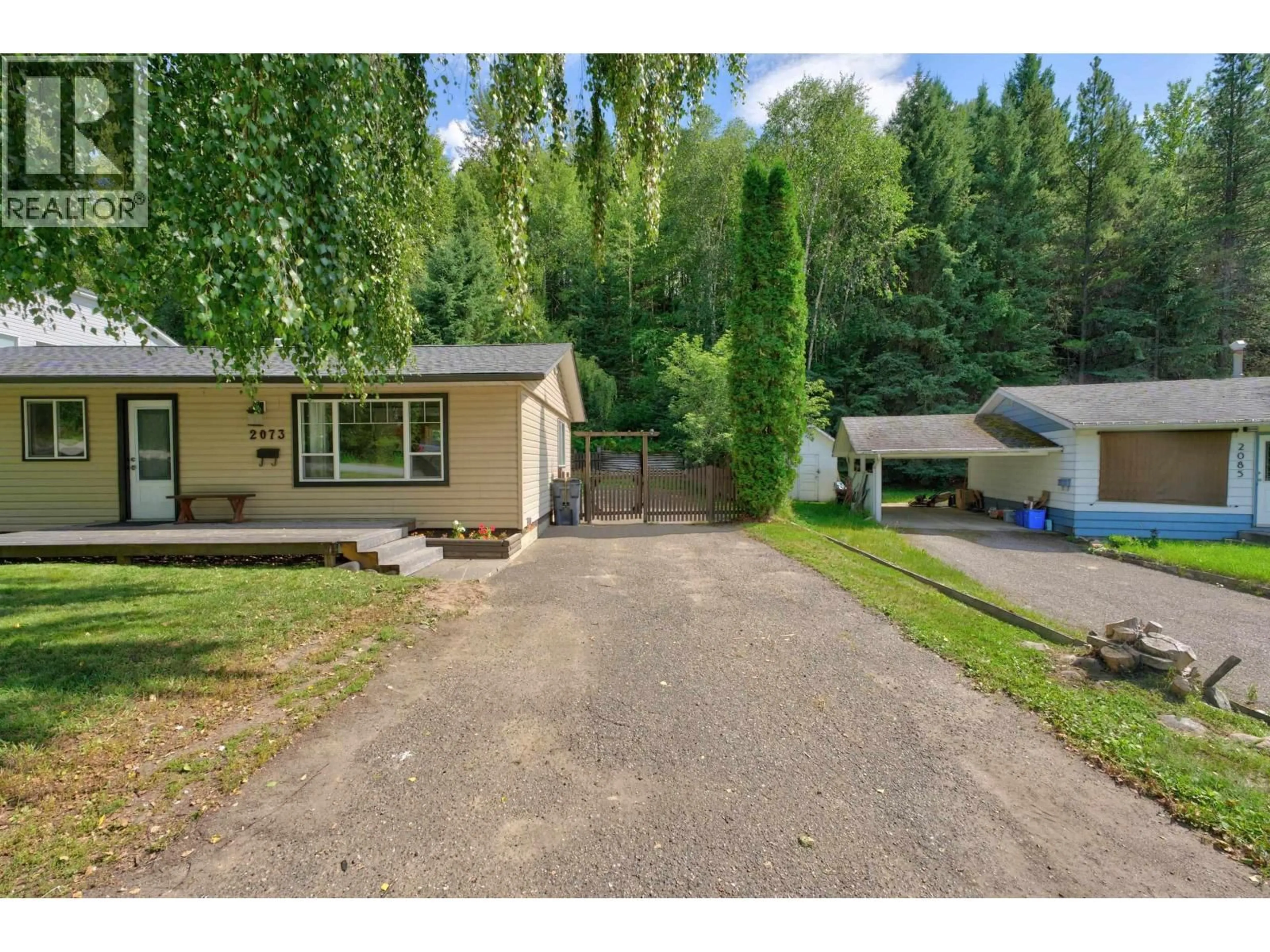 A pic from outside/outdoor area/front of a property/back of a property/a pic from drone, street for 2073 WOODHAVEN DRIVE, Prince George British Columbia V2K3C4