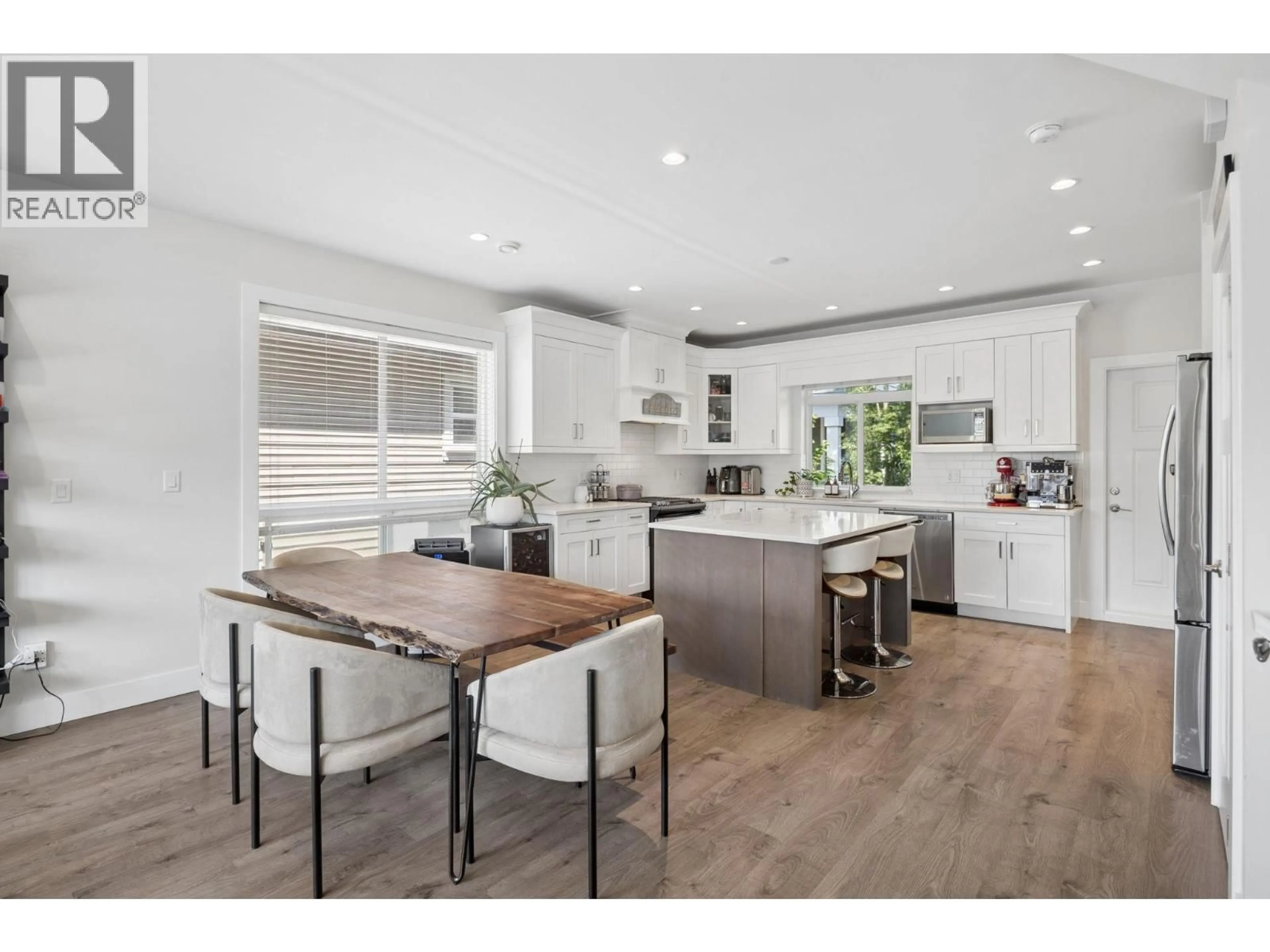 Open concept kitchen, wood/laminate floor for 4855 ELLIS LANE, Delta British Columbia V4K0C5