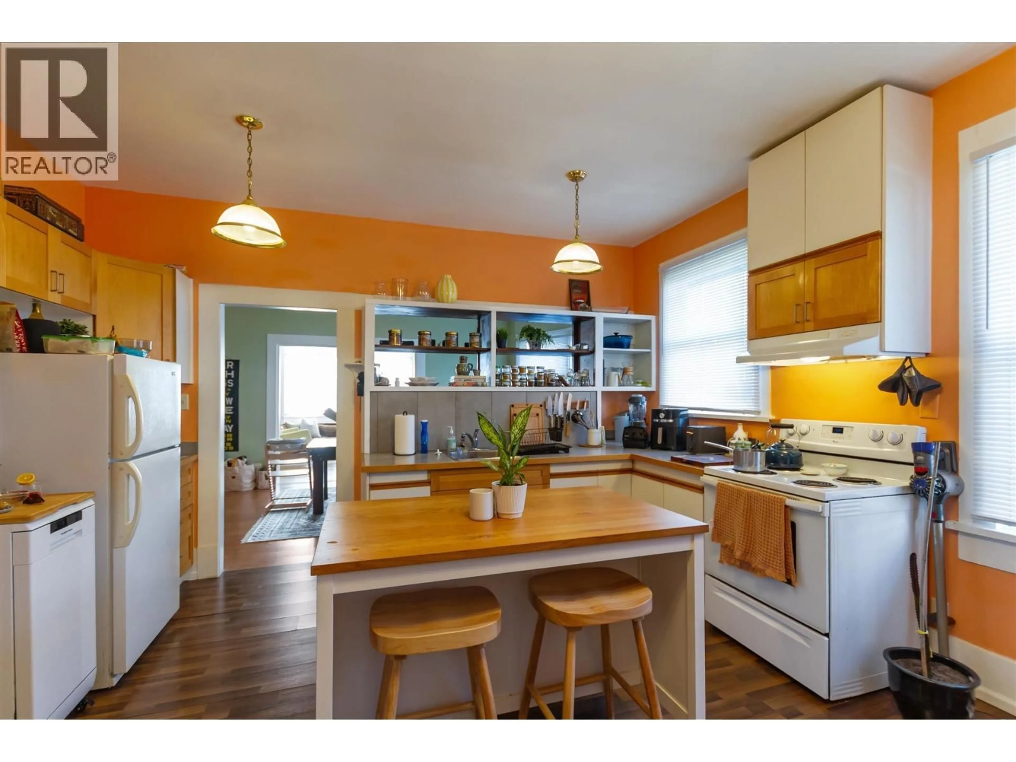 Open concept kitchen, wood/laminate floor for 1925 ADANAC STREET, Vancouver British Columbia V5L2E5