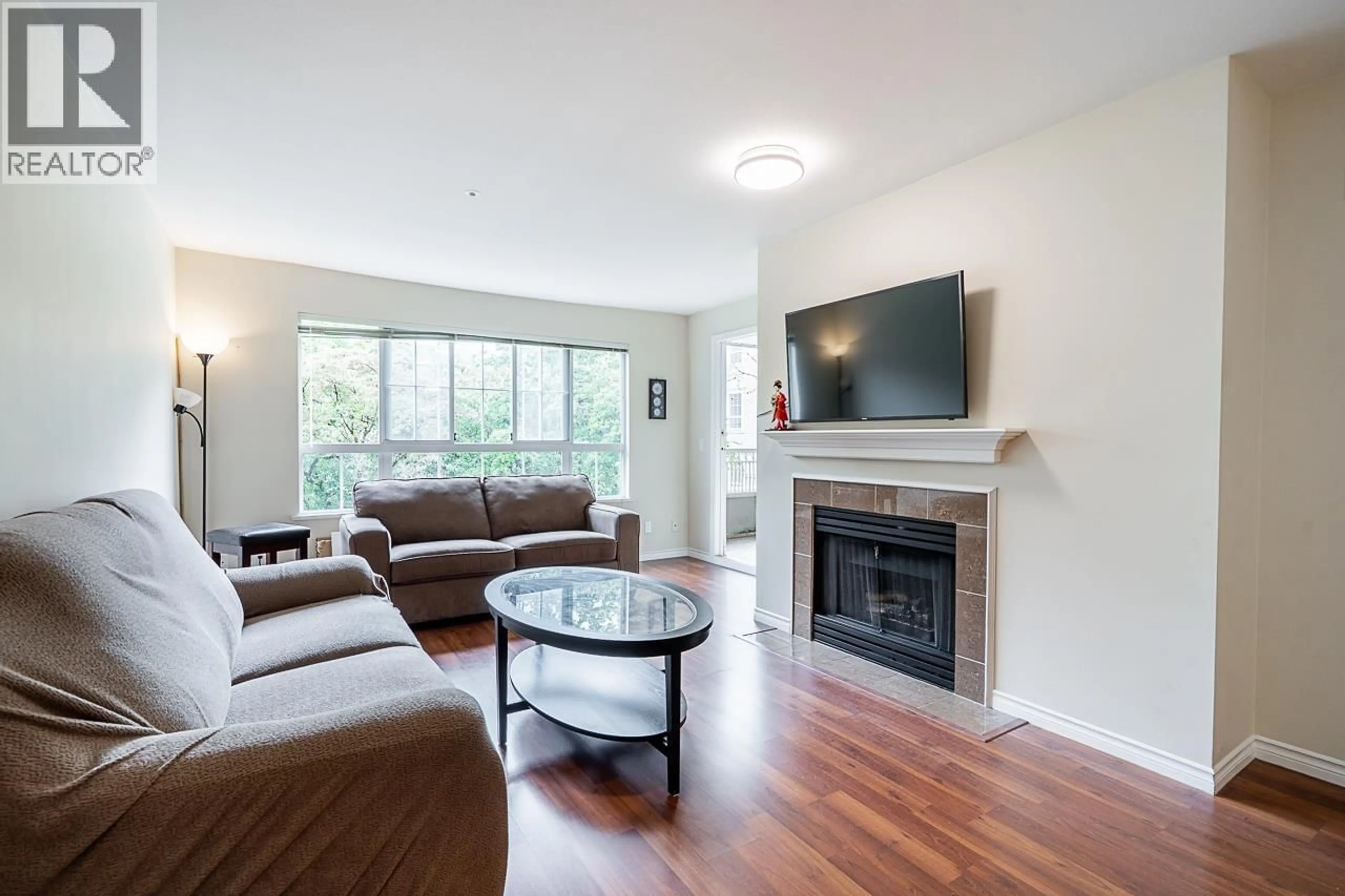 Living room with furniture, wood/laminate floor for 227 - 2980 PRINCESS CRESCENT, Coquitlam British Columbia V3B7R4