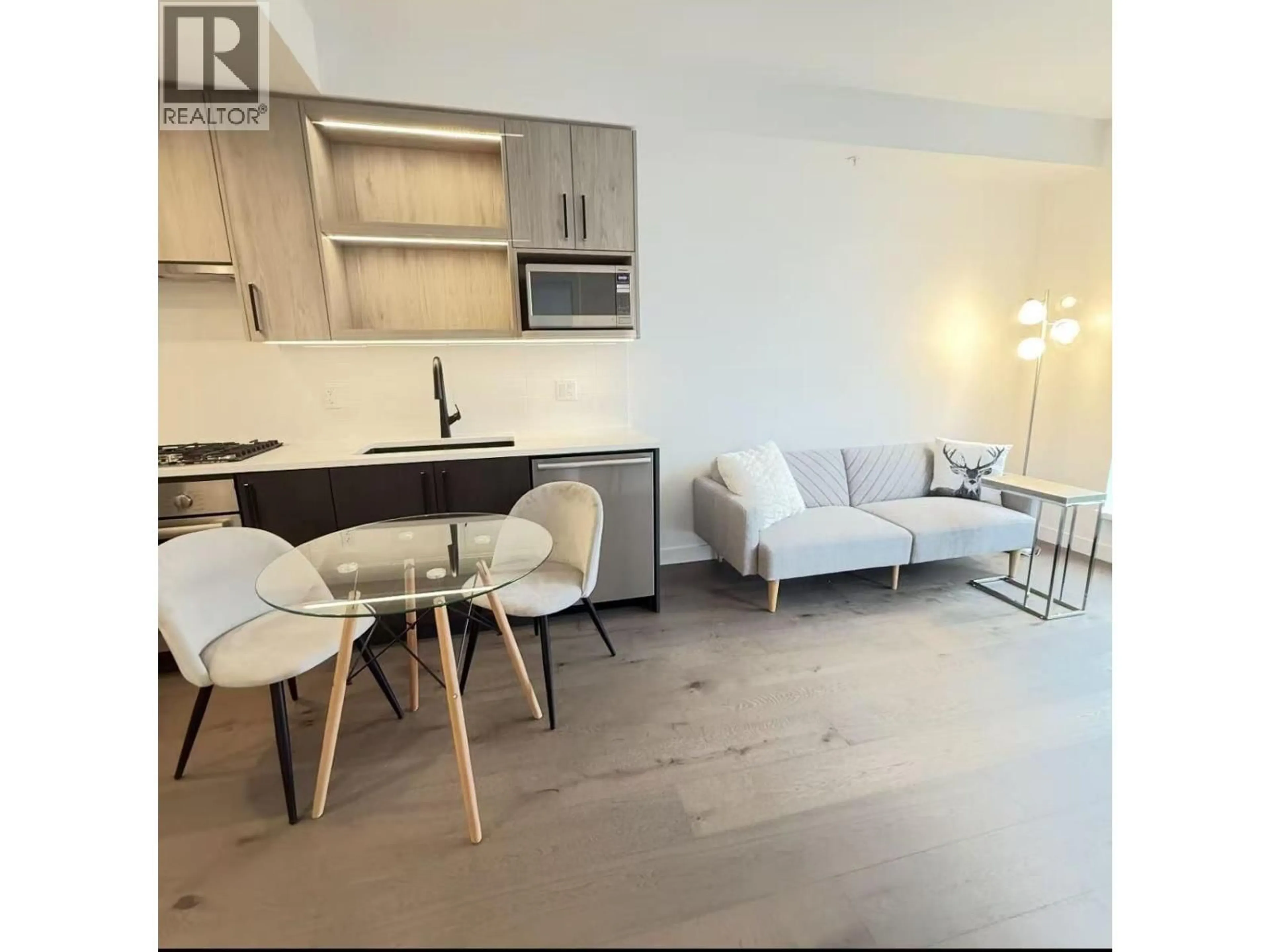 Living room with furniture, wood/laminate floor for 313 - 6859 CAMBIE STREET, Vancouver British Columbia V6P3H1