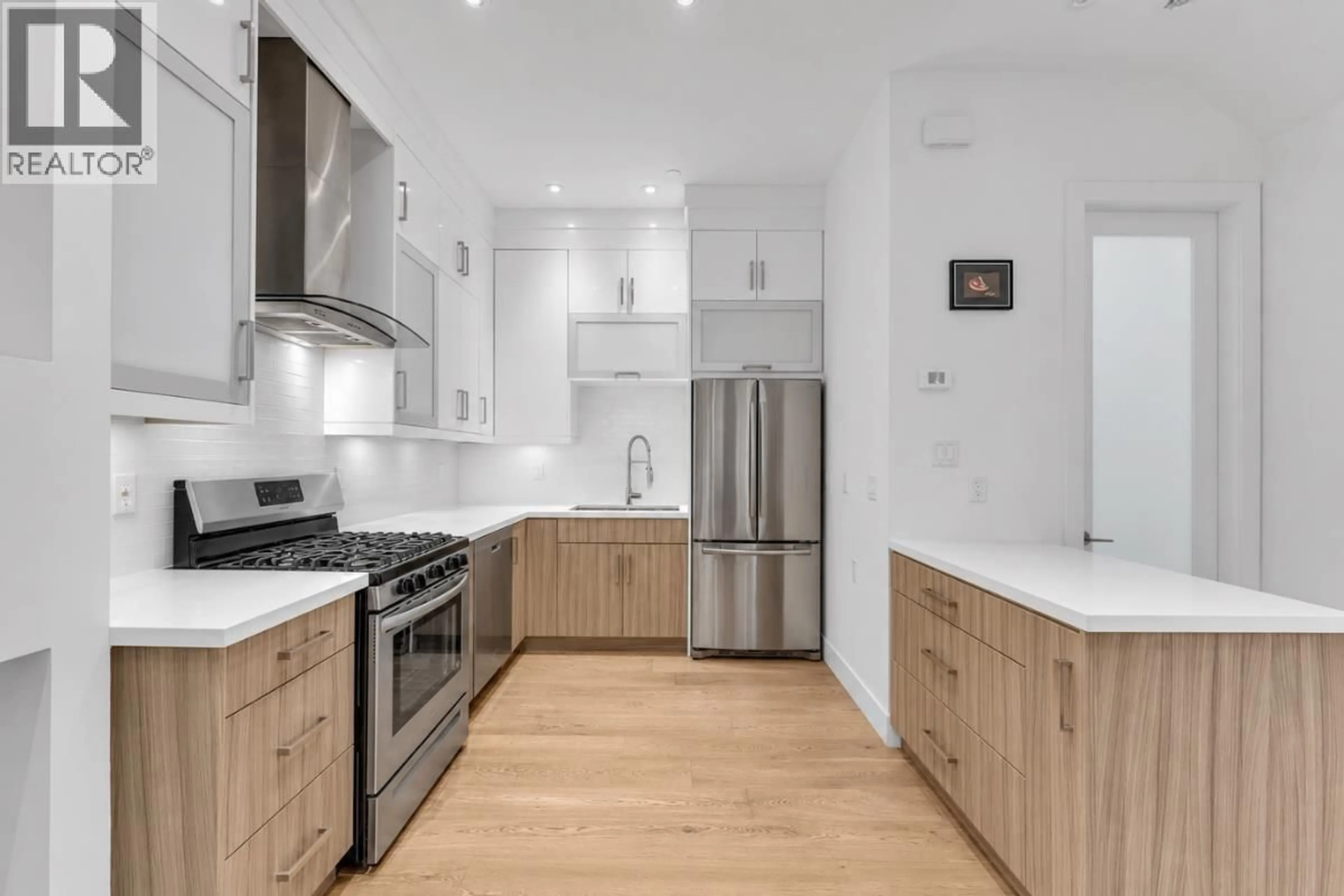 Open concept kitchen, wood/laminate floor for 2 - 1136 PENDER STREET, Vancouver British Columbia V6A1W5