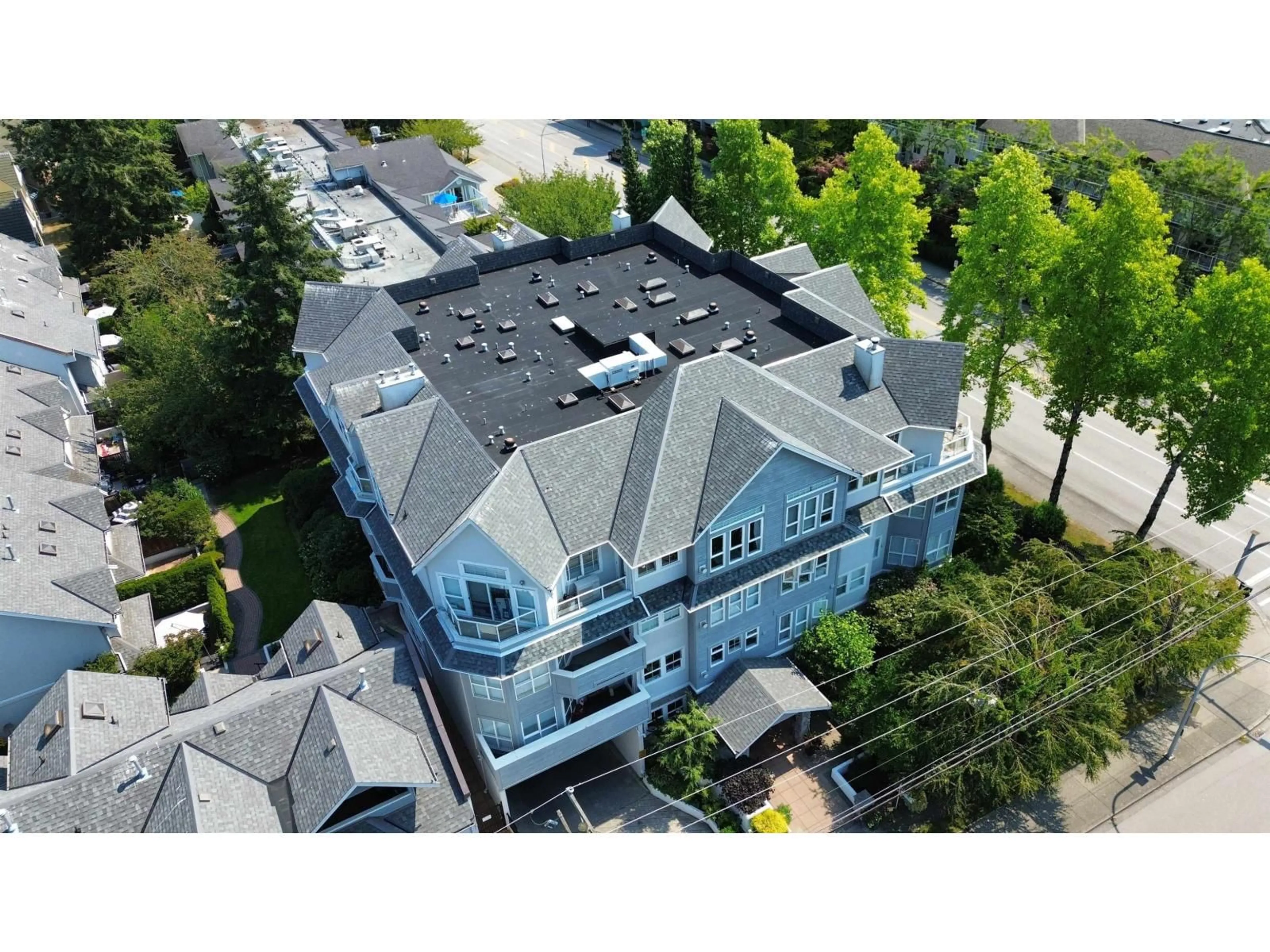 A pic from outside/outdoor area/front of a property/back of a property/a pic from drone, building for 406 - 1630 154 STREET, Surrey British Columbia V4A9T3