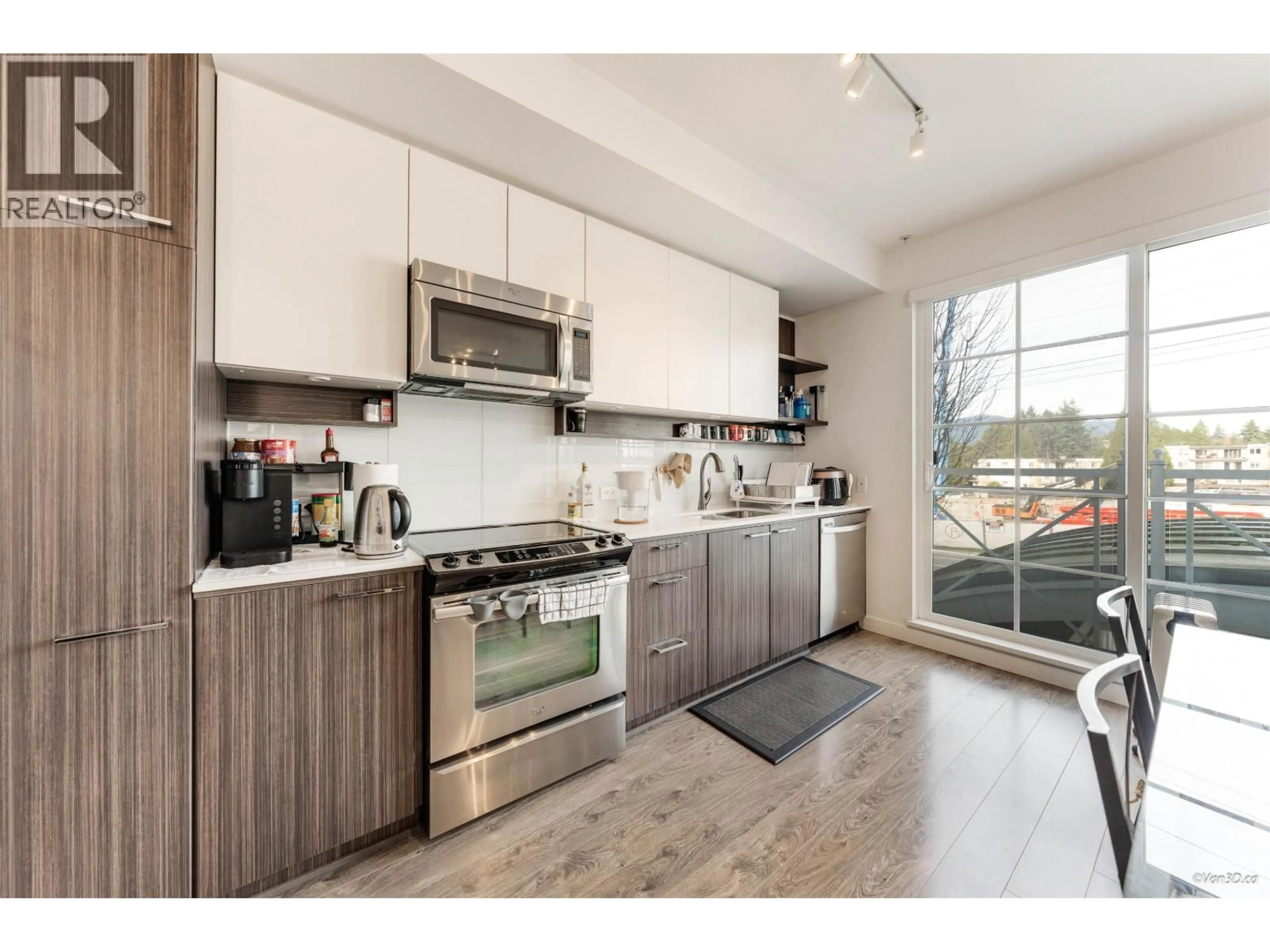 Open concept kitchen, wood/laminate floor for 201 - 618 COMO LAKE AVENUE, Coquitlam British Columbia V3J0G1