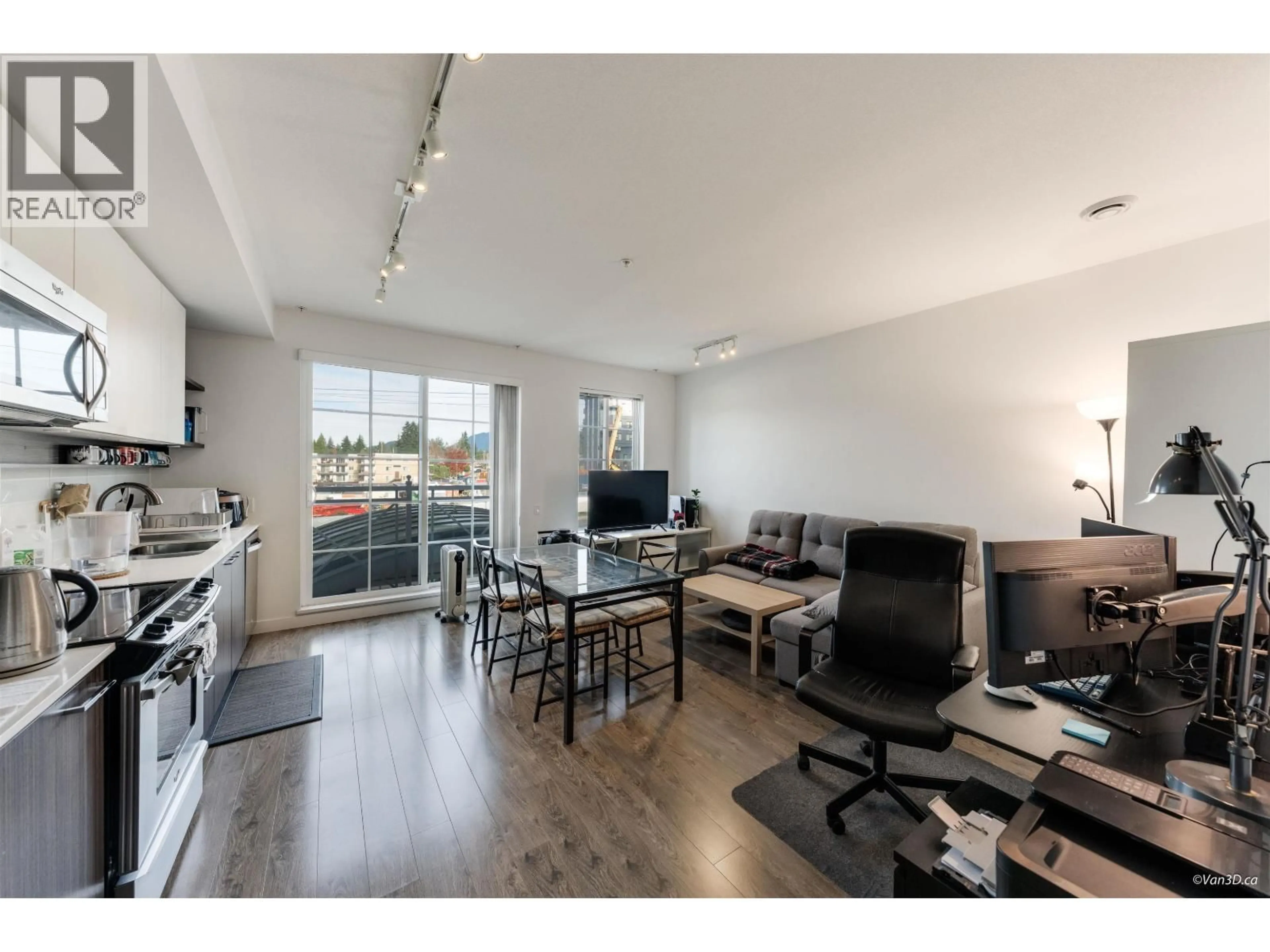 Living room with furniture, wood/laminate floor for 201 - 618 COMO LAKE AVENUE, Coquitlam British Columbia V3J0G1