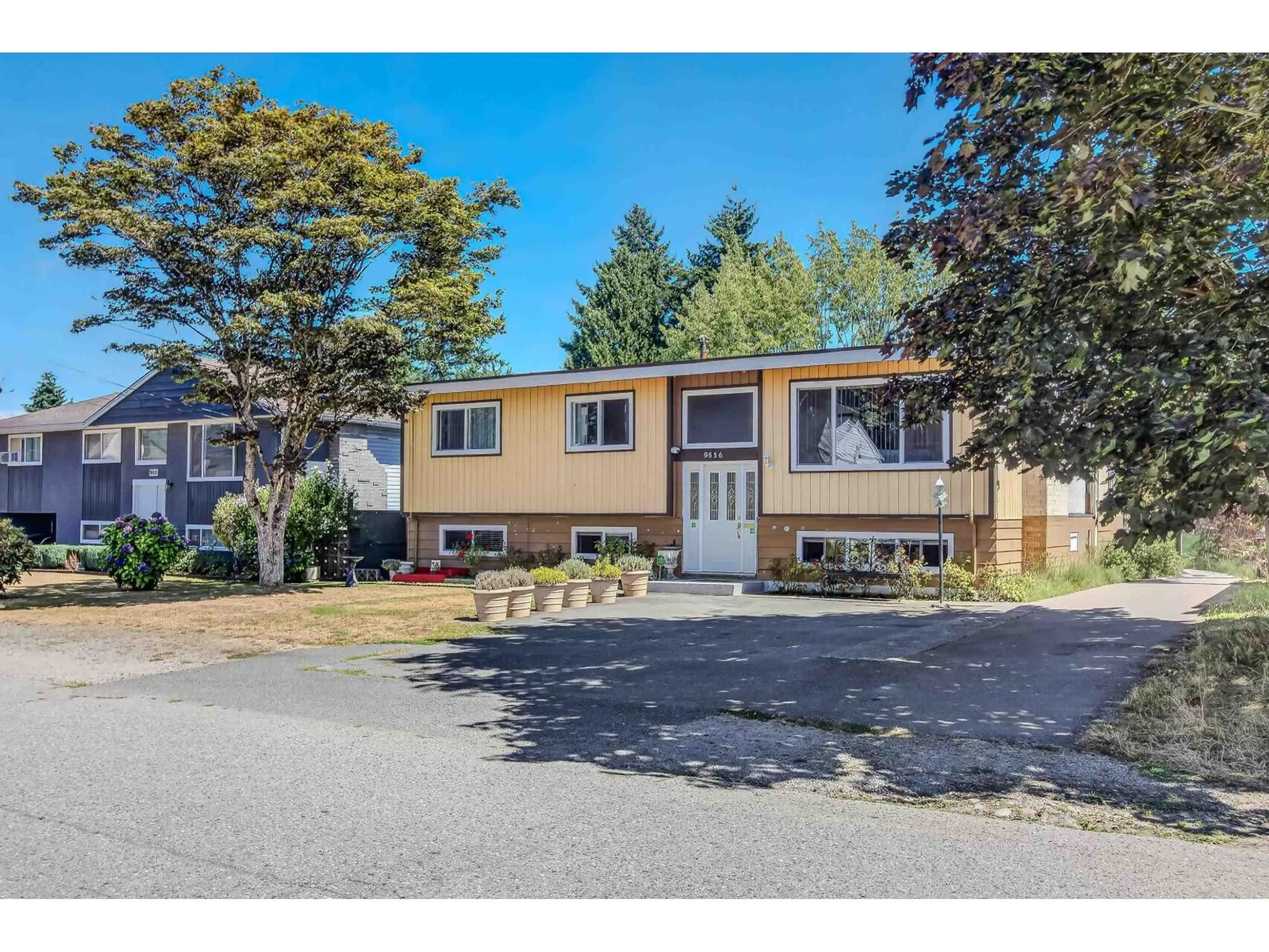 Home with vinyl exterior material, street for 9656 125 STREET, Surrey British Columbia V3V4Y1