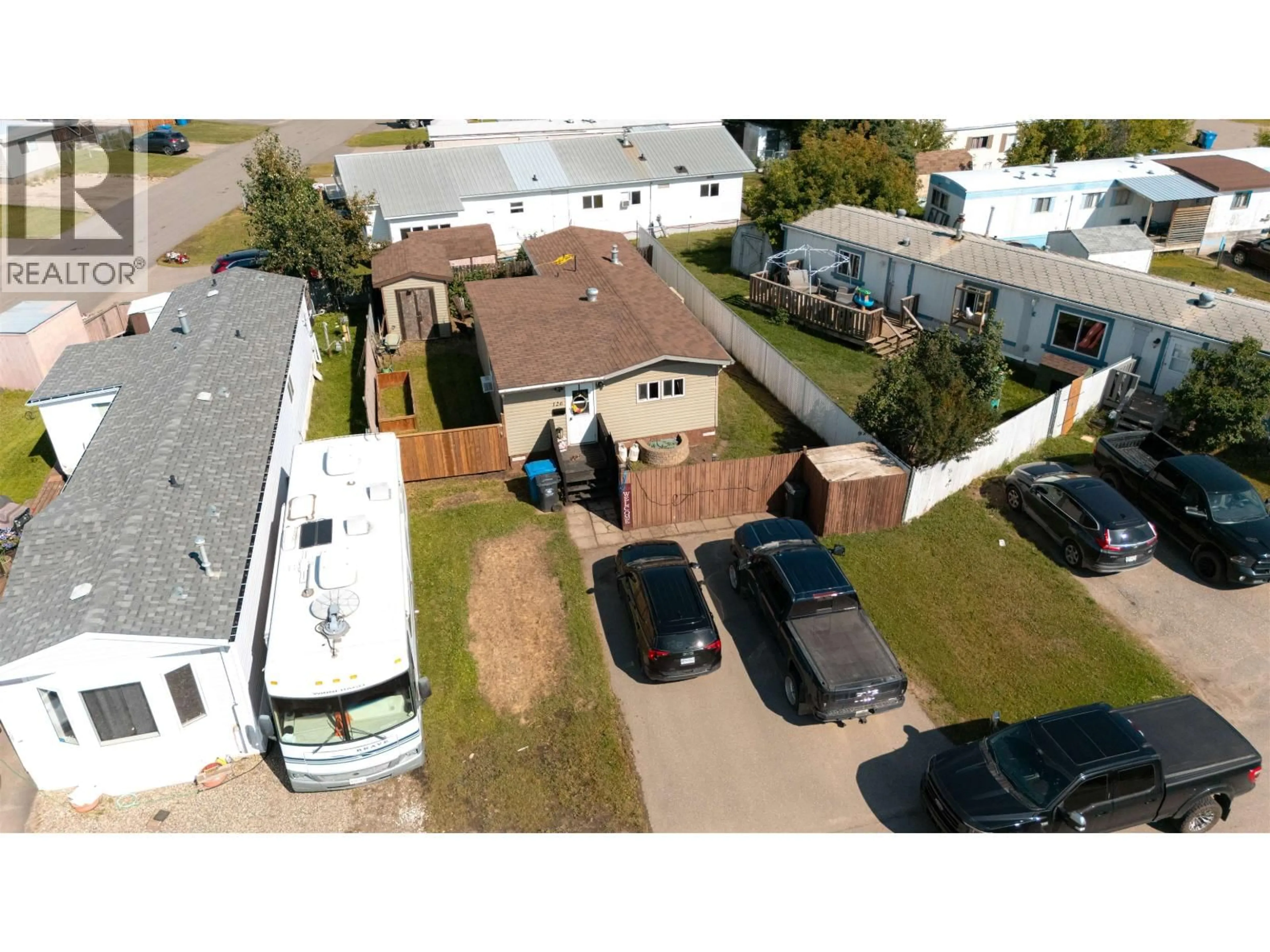 A pic from outside/outdoor area/front of a property/back of a property/a pic from drone, street for 126 - 8420 ALASKA ROAD, Fort St. John British Columbia V1J4J6