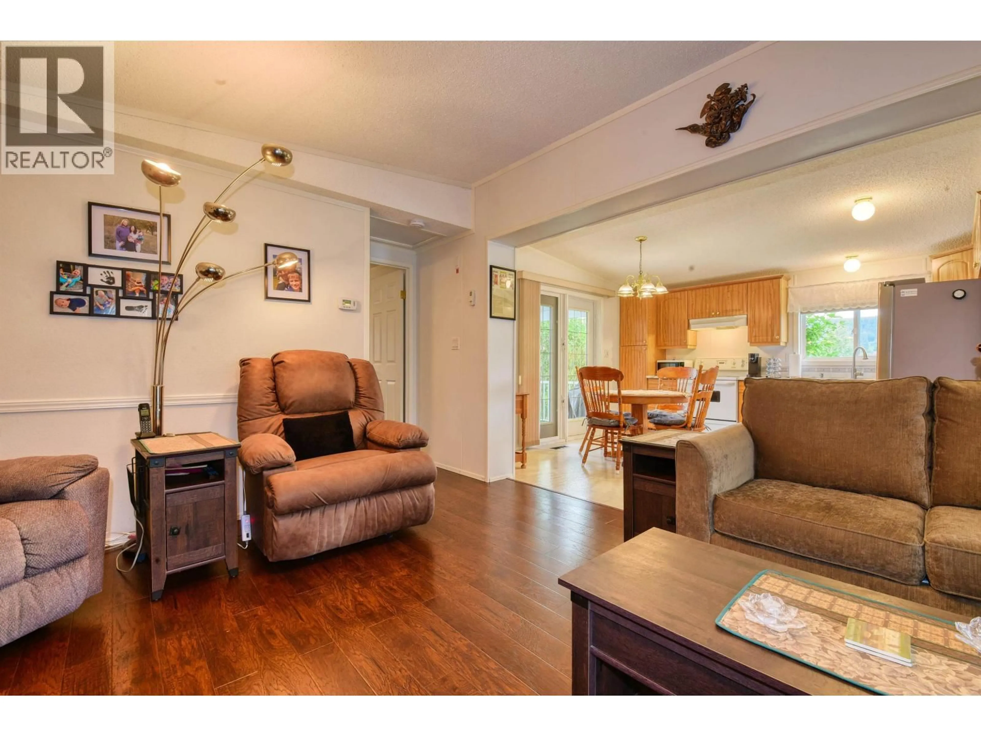 Living room with furniture, wood/laminate floor for 110 - 375 MANDARINO PLACE, Williams Lake British Columbia V2G4V3
