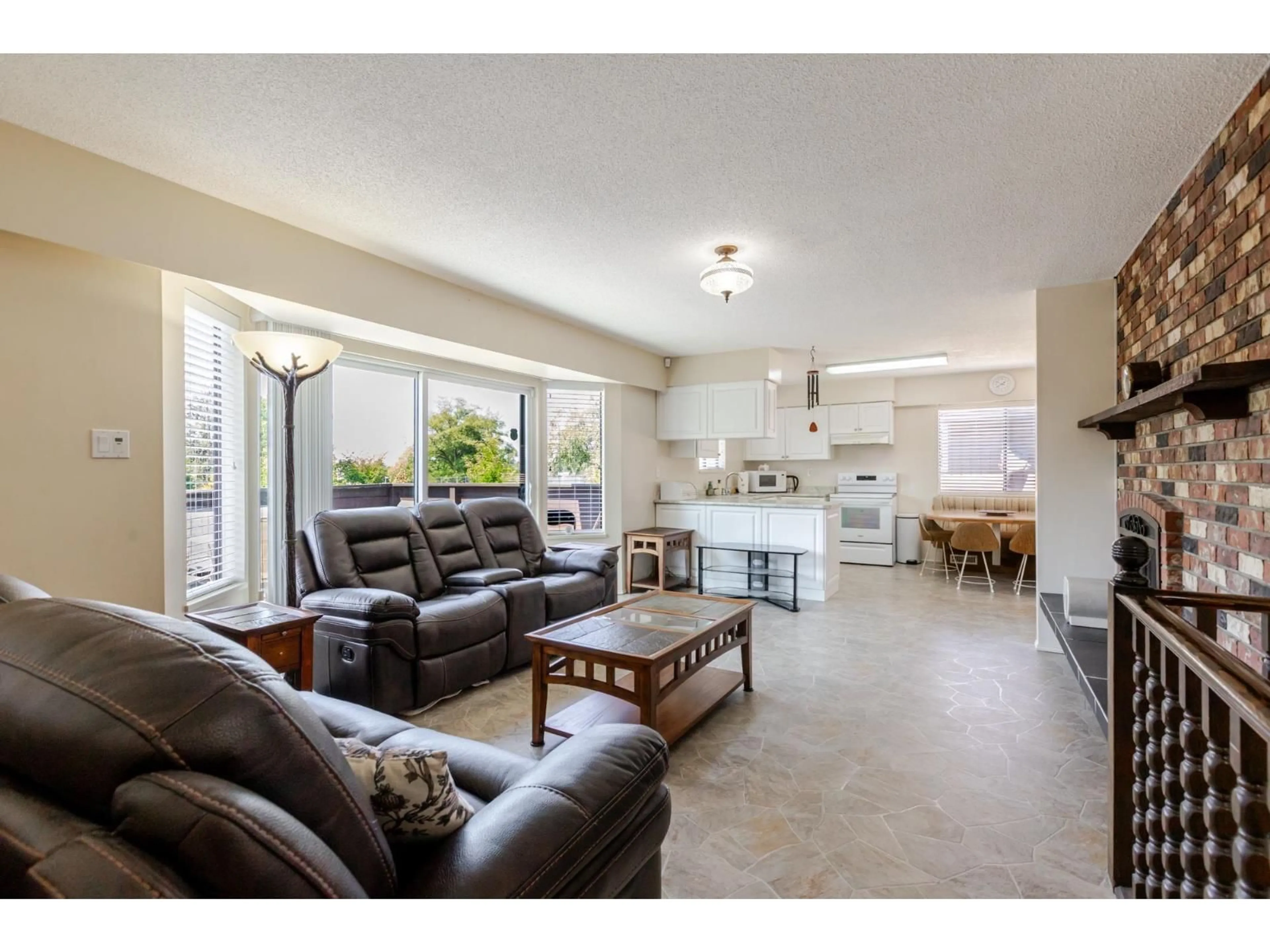Living room with furniture, ceramic/tile floor for 9075 117 STREET, Delta British Columbia V4C7L6