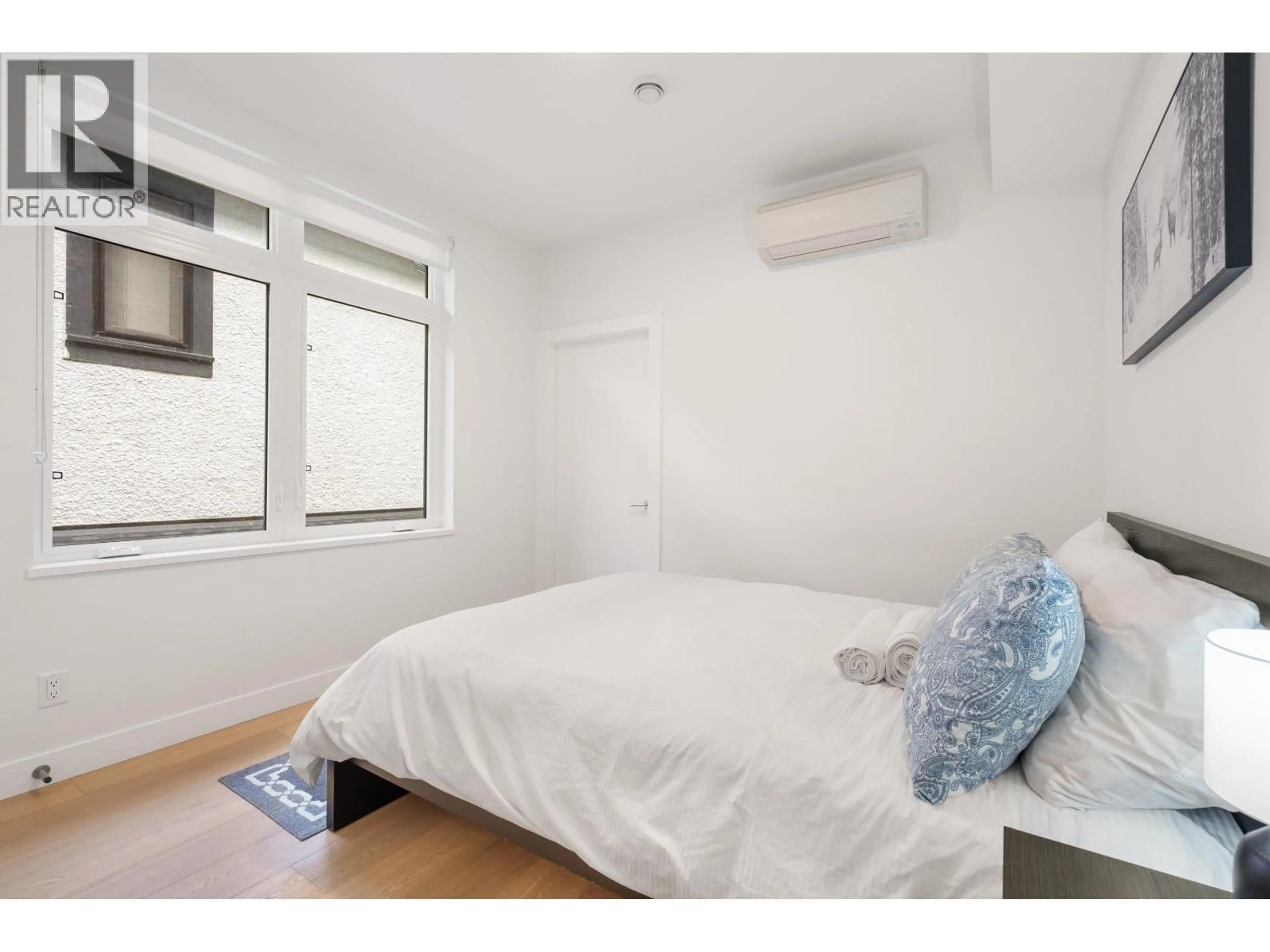 Bedroom with bed, wood/laminate floor for 2727 14TH AVENUE, Vancouver British Columbia V6K2X1