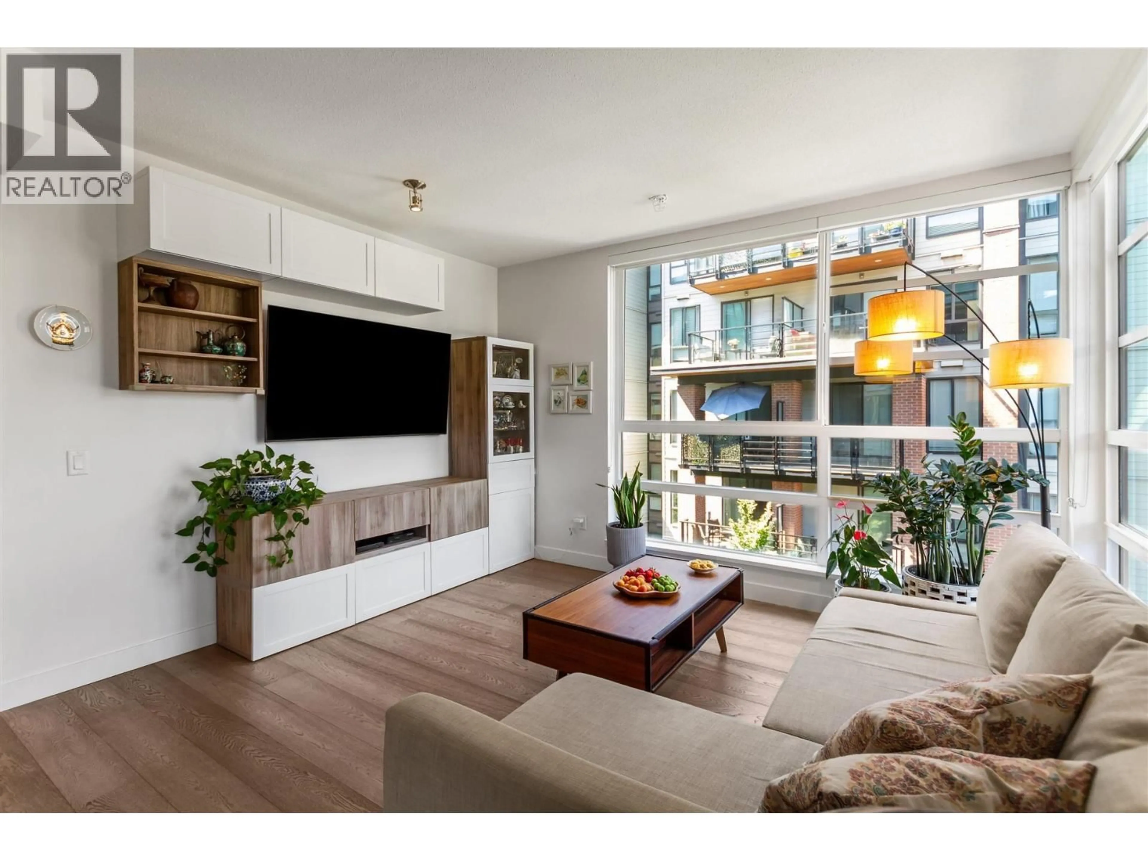Living room with furniture, wood/laminate floor for 404 - 719 3RD STREET, North Vancouver British Columbia V7M0E7