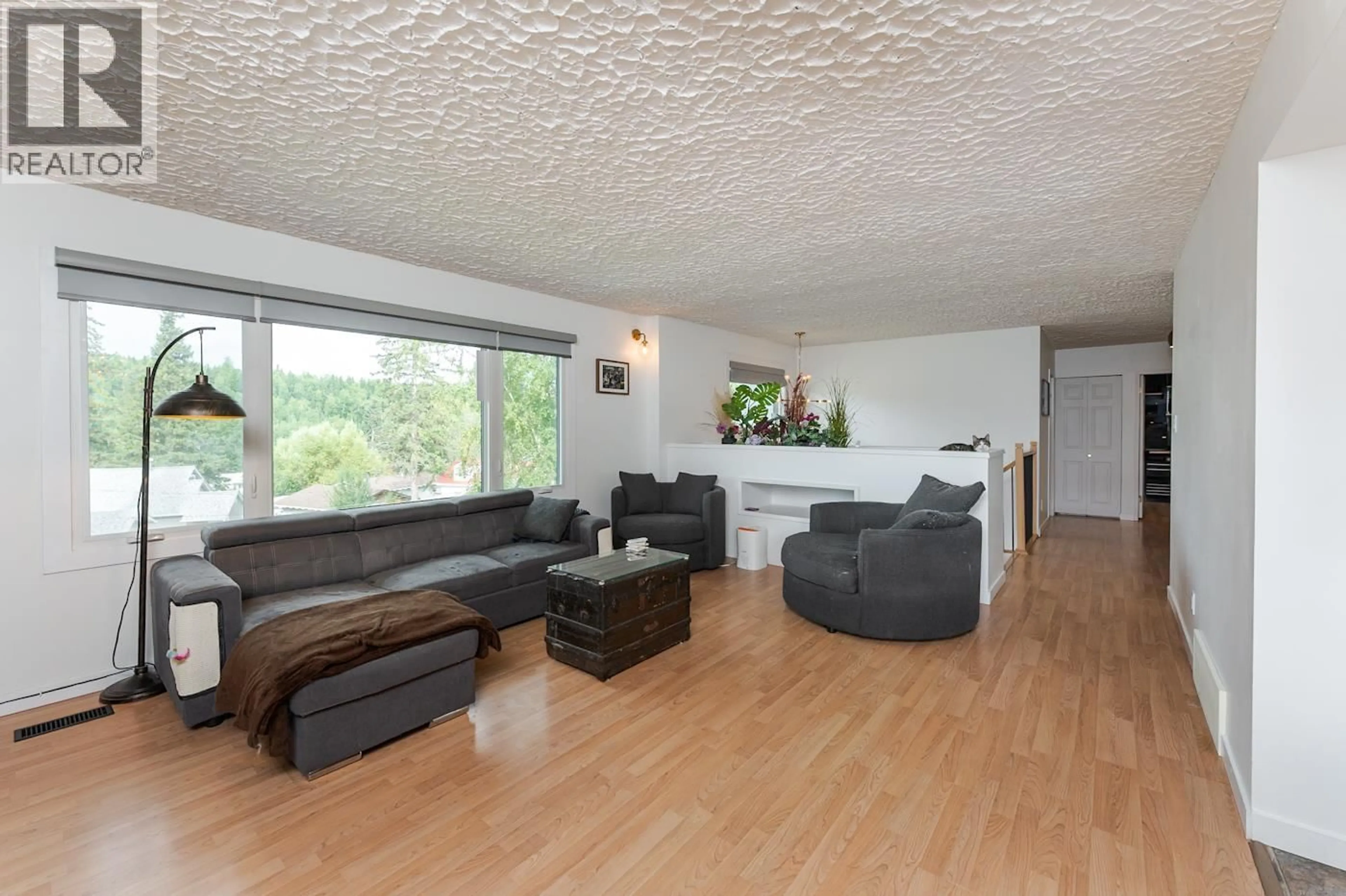 Living room with furniture, wood/laminate floor for 1880 HOUGHTALING ROAD, Prince George British Columbia V2K1L6