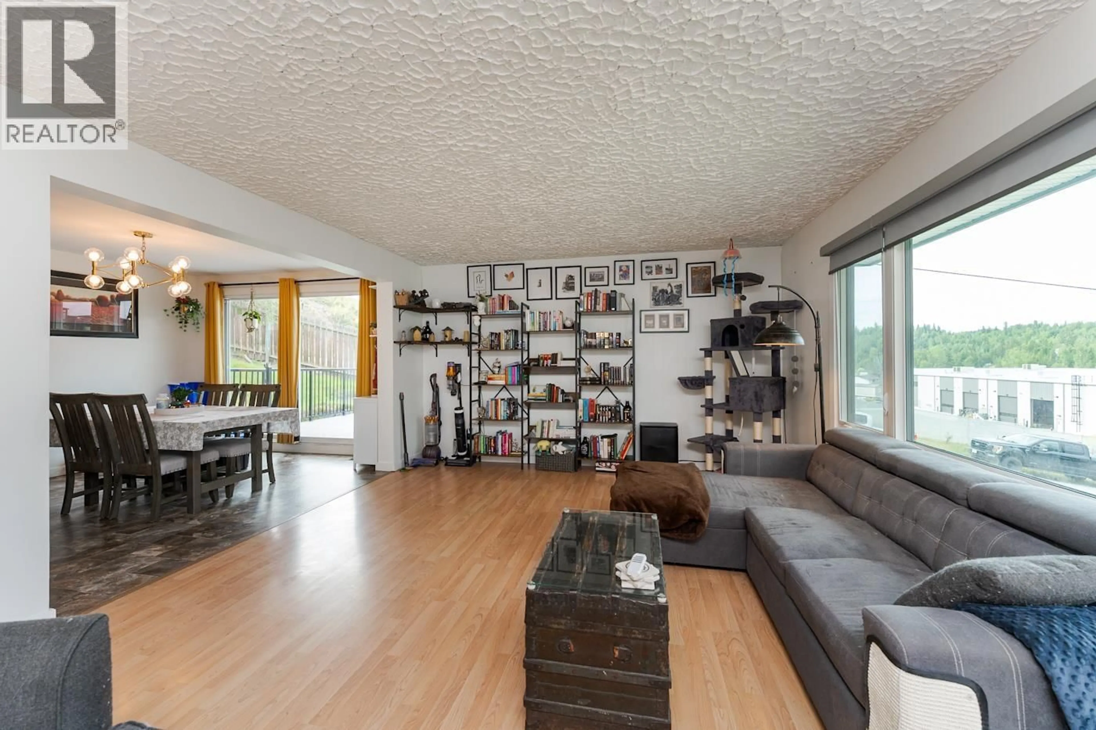 Living room with furniture, wood/laminate floor for 1880 HOUGHTALING ROAD, Prince George British Columbia V2K1L6