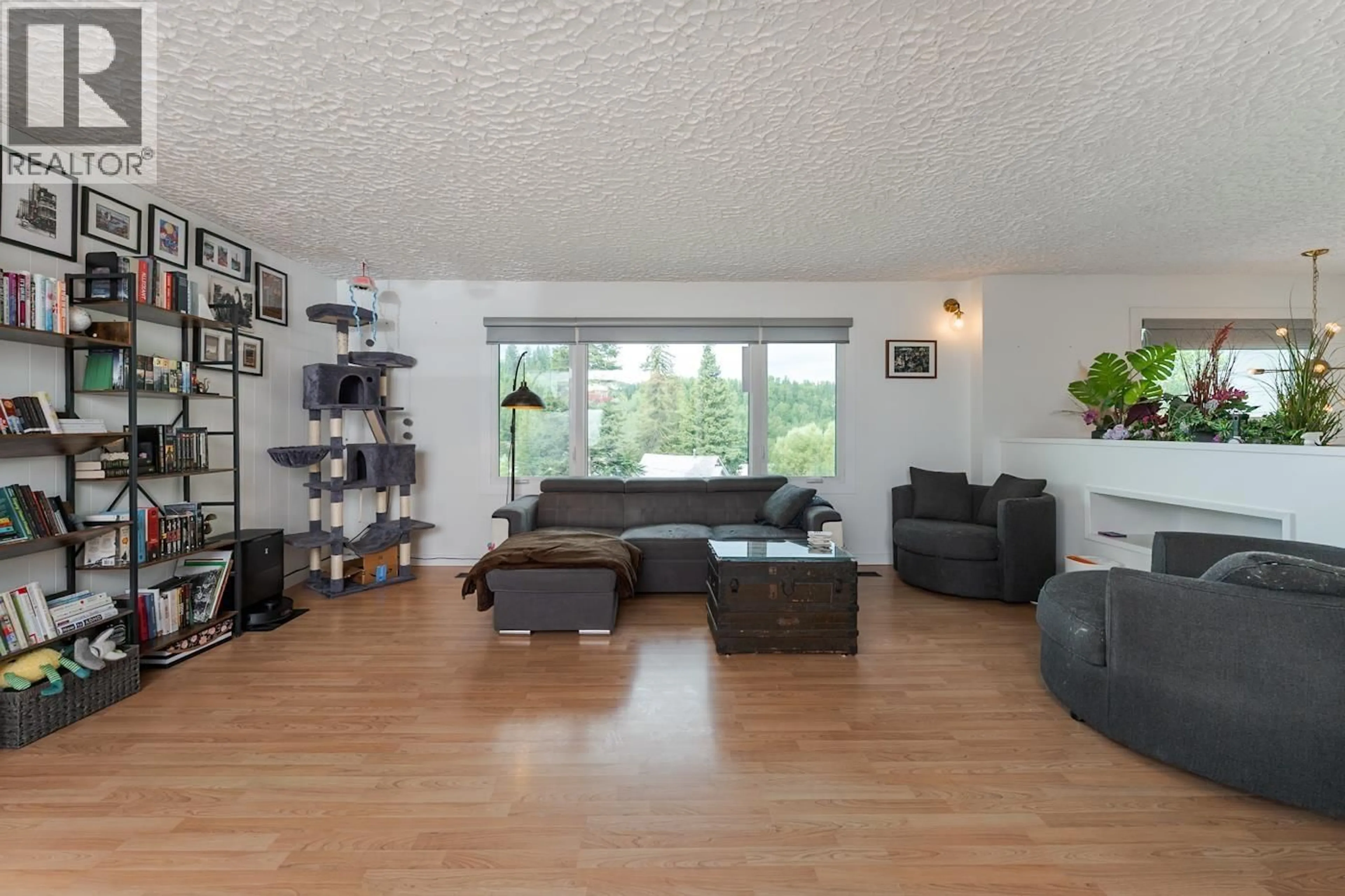 Living room with furniture, wood/laminate floor for 1880 HOUGHTALING ROAD, Prince George British Columbia V2K1L6