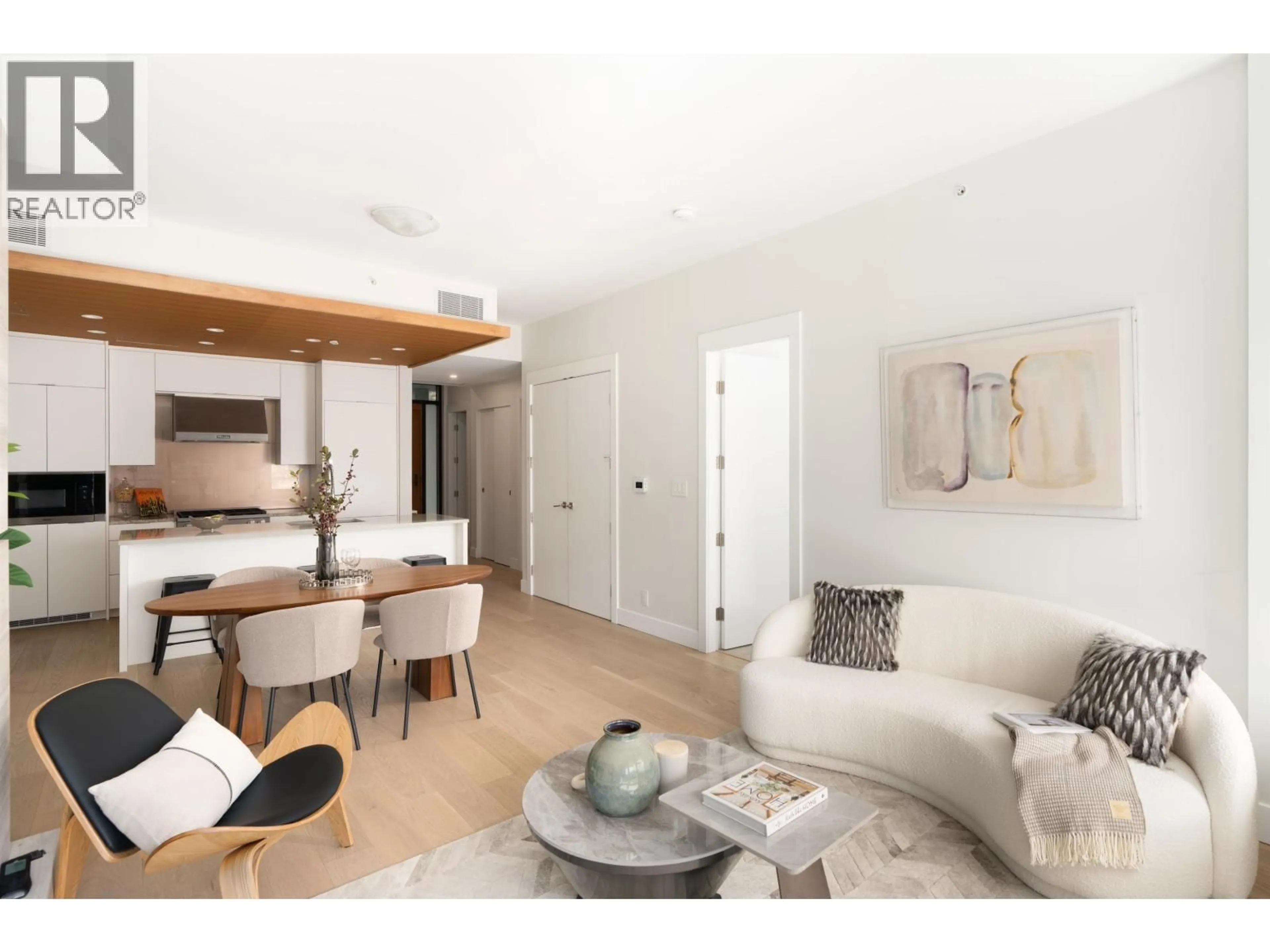 Living room with furniture, wood/laminate floor for 305 - 6707 NELSON AVENUE, West Vancouver British Columbia V7W2B2