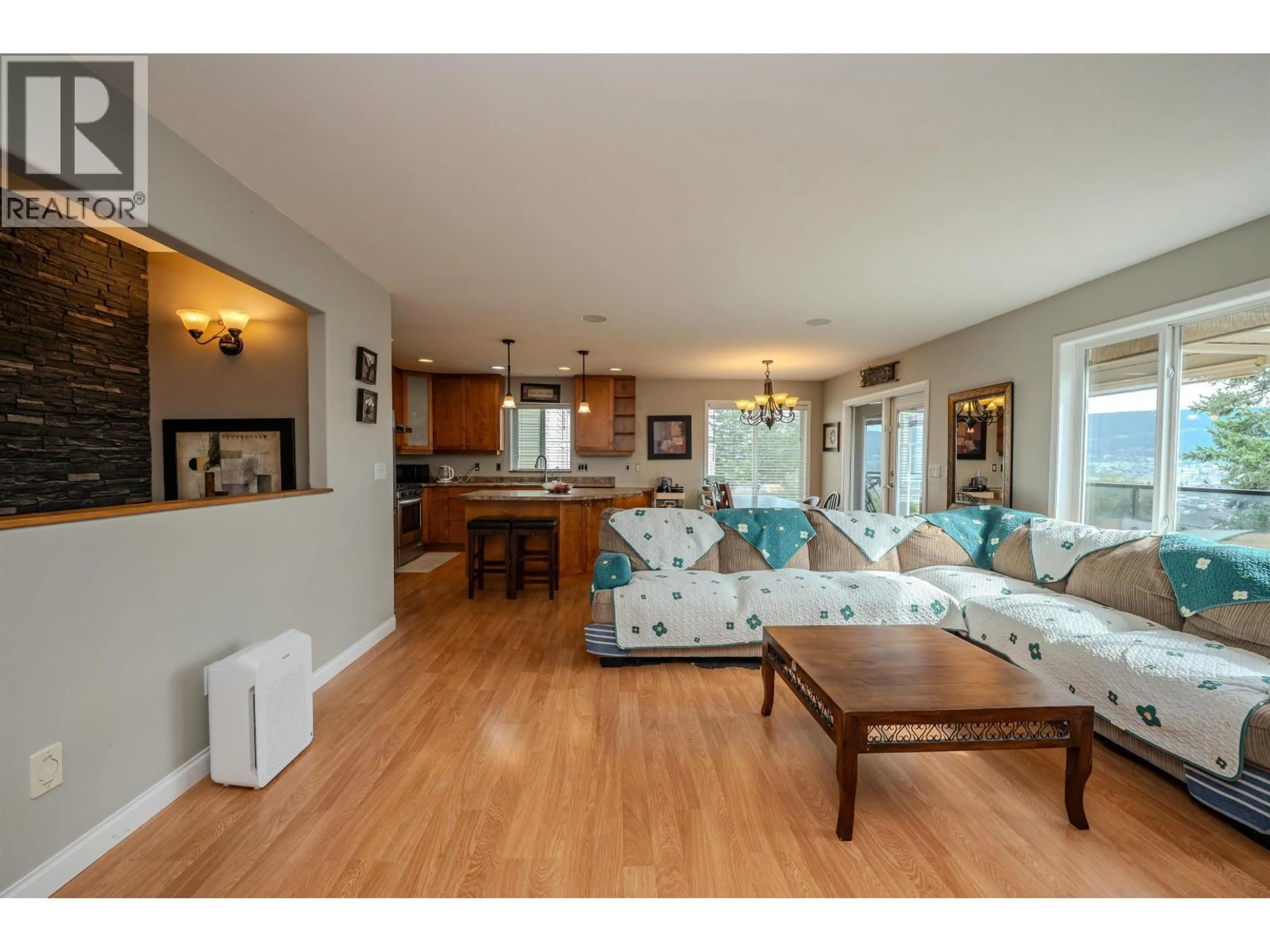 Living room with furniture, wood/laminate floor for 240 WESTRIDGE DRIVE, Williams Lake British Columbia V2G5H8