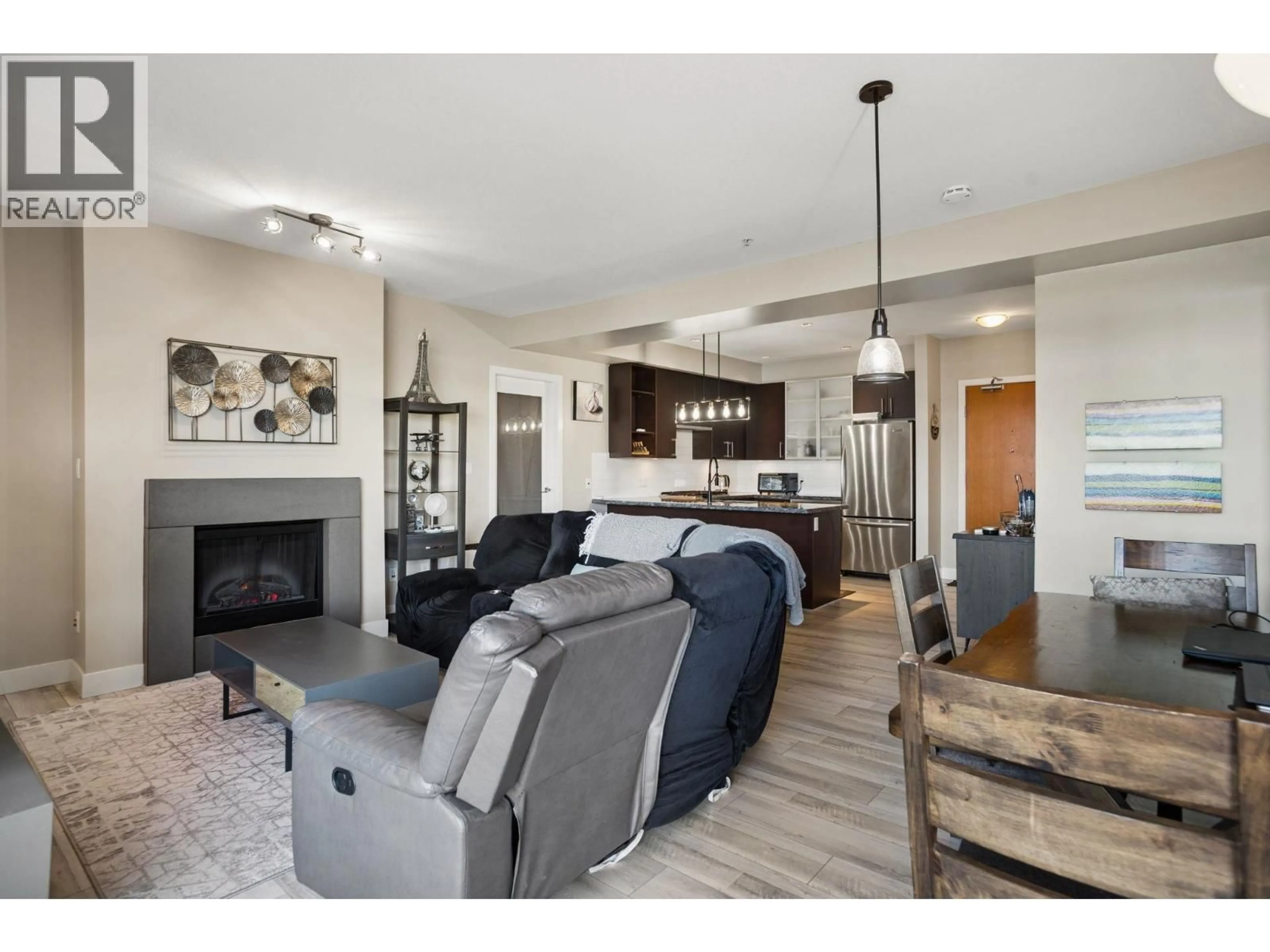 Living room with furniture, wood/laminate floor for 201 - 14300 RIVERPORT WAY, Richmond British Columbia V6W0A4