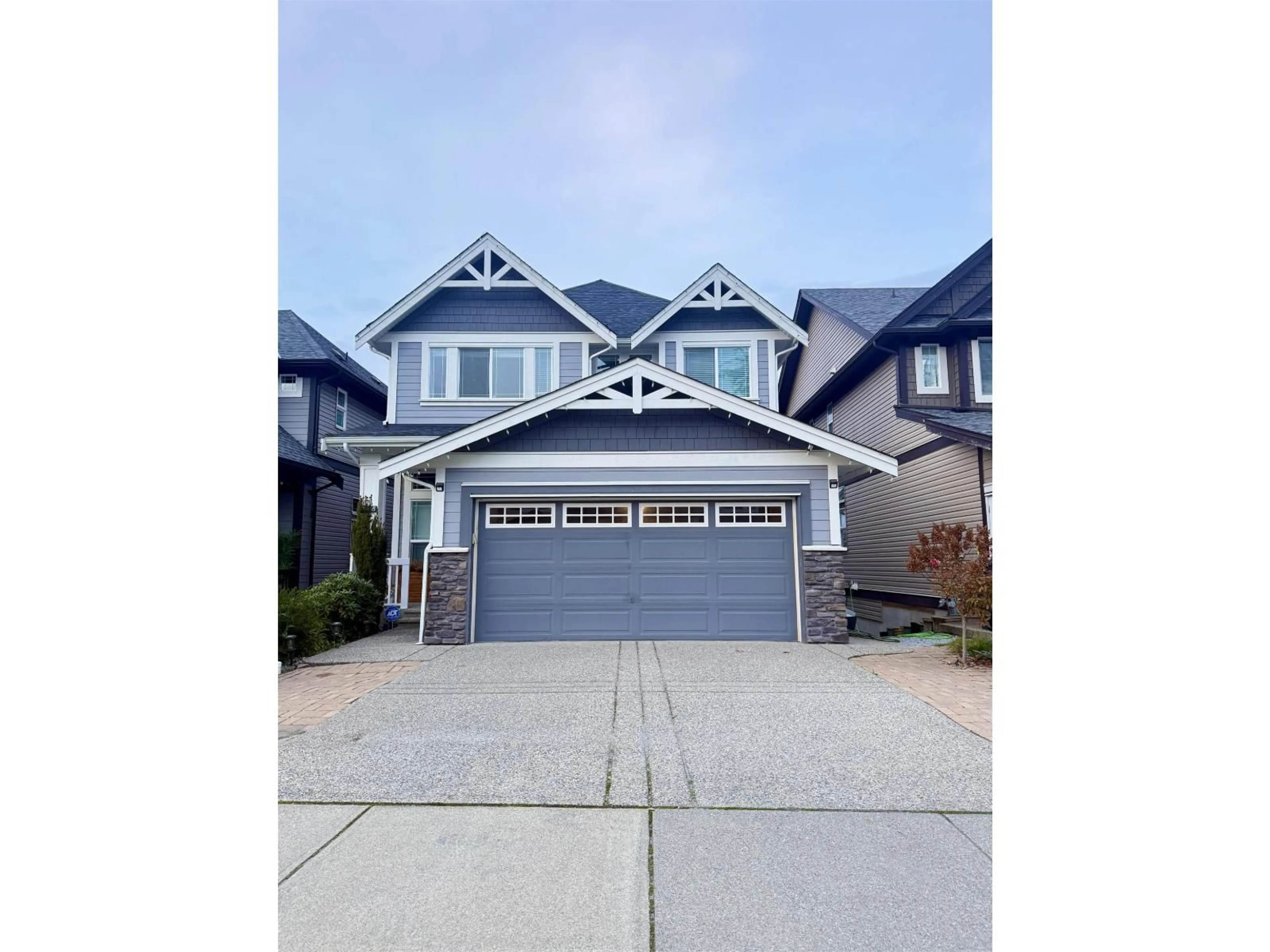 Home with vinyl exterior material, street for 20455 83A AVENUE, Langley British Columbia V2Y0S2