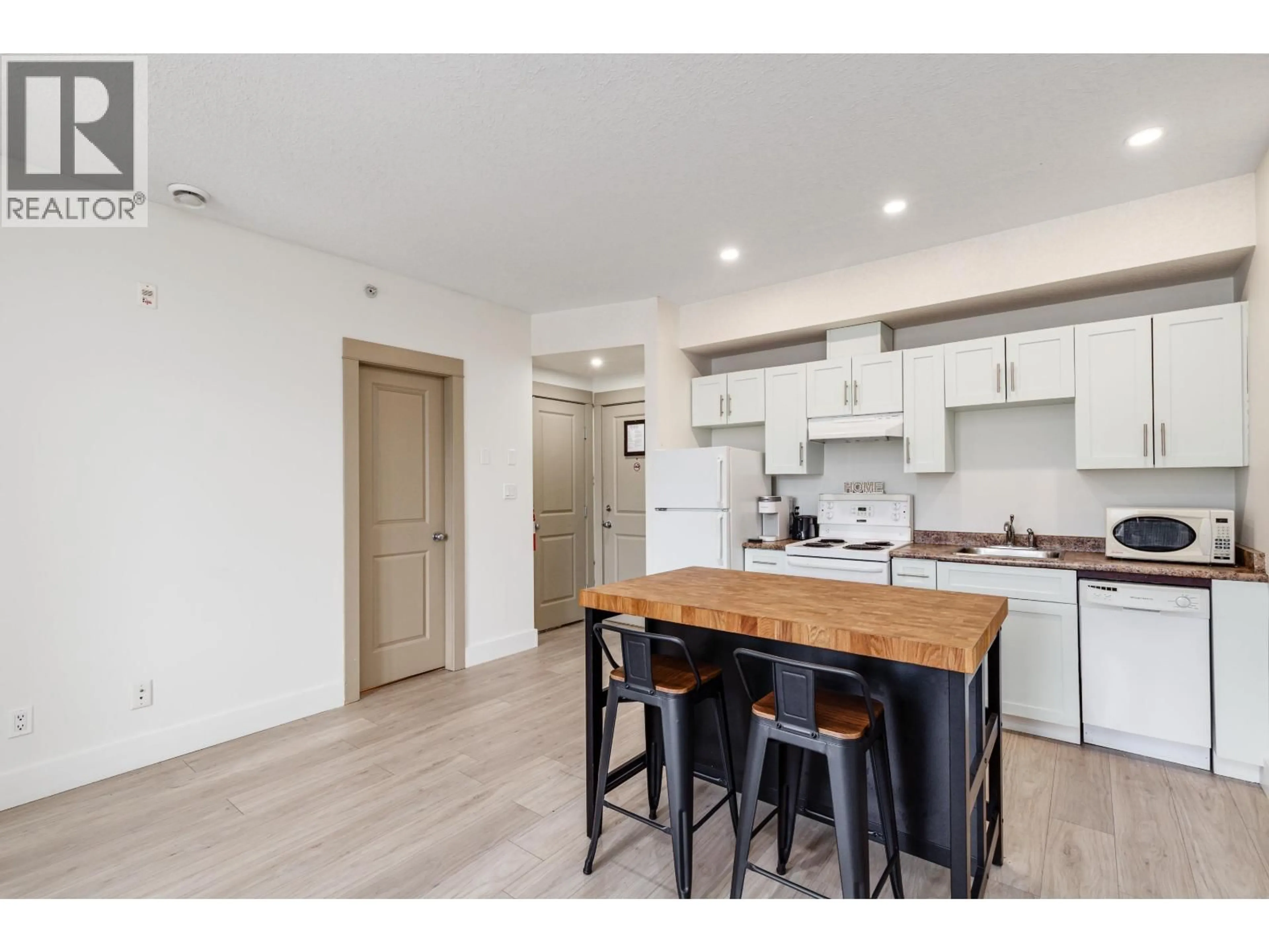 Open concept kitchen, wood/laminate floor for 309 - 7330 ARBUTUS STREET, Pemberton British Columbia V0N2L1