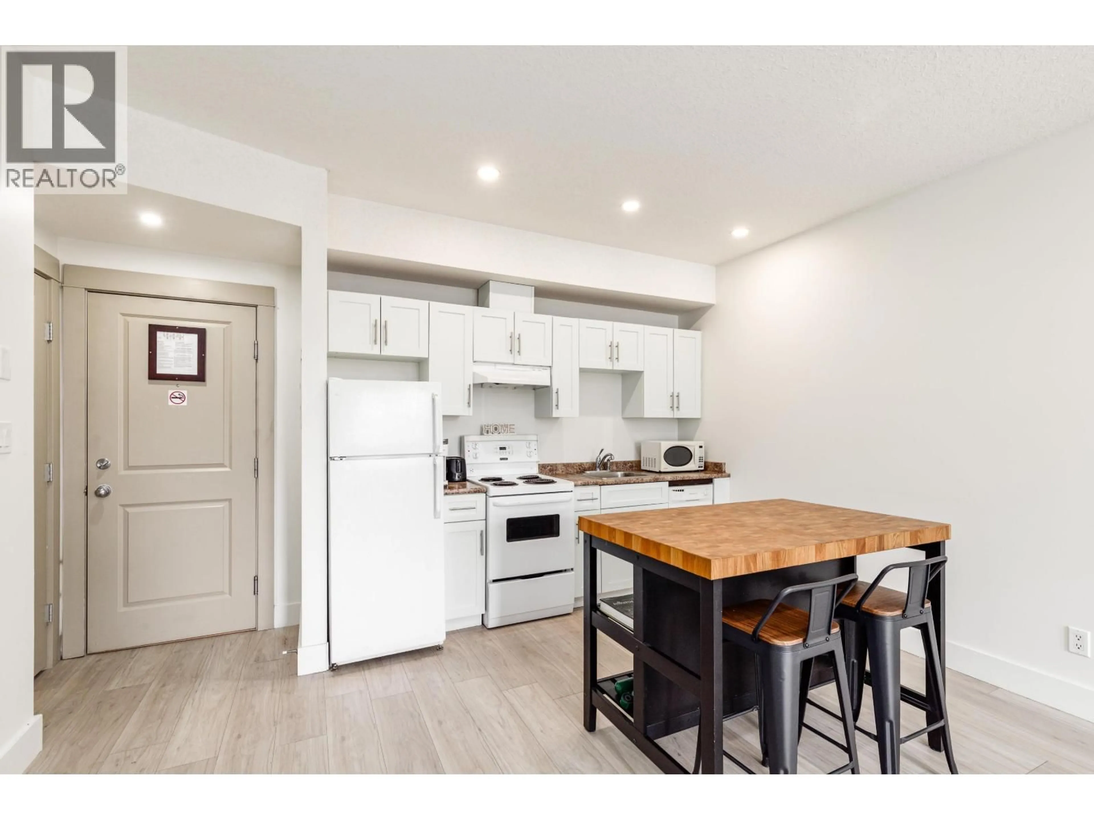 Open concept kitchen, wood/laminate floor for 309 - 7330 ARBUTUS STREET, Pemberton British Columbia V0N2L1