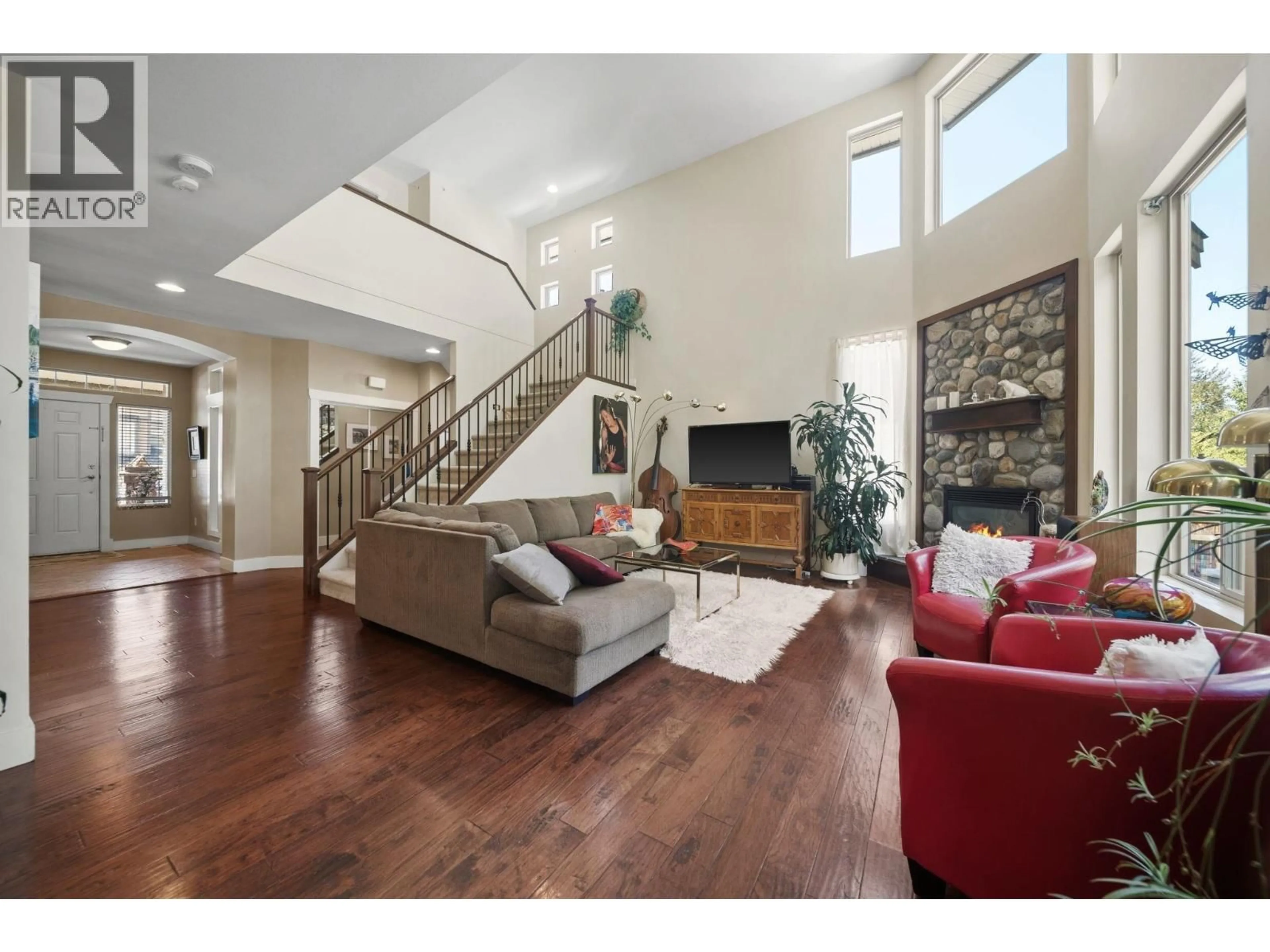 Living room with furniture, wood/laminate floor for 24781 MCCLURE DRIVE, Maple Ridge British Columbia V2W0A5